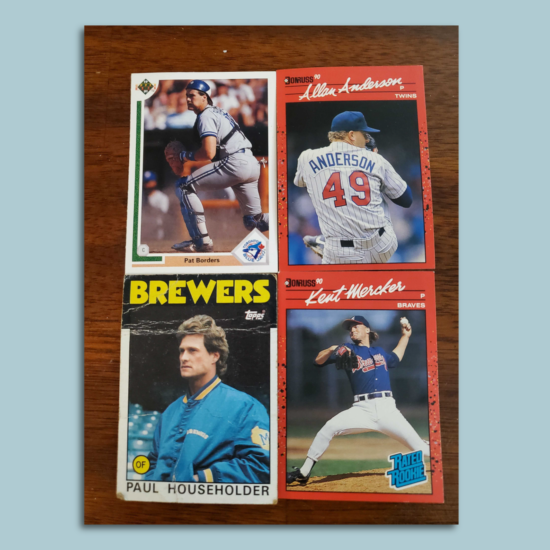 Four baseball cards in a square. 