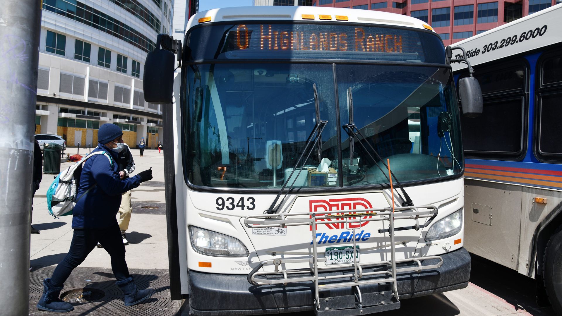 Passengers get onboard an RTD bus in Denver. Photo: Hyoung Chang/Denver Post via Getty Images