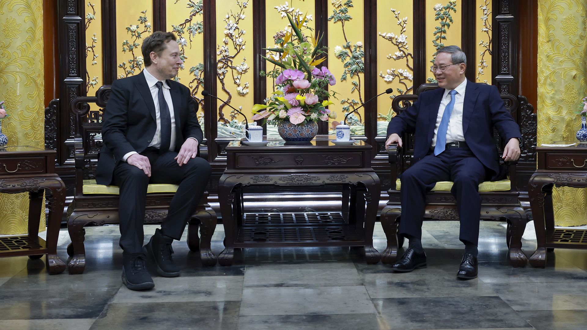 Elon Musk meets with Chinese Premier Li Qiang in Beijing yesterday. 