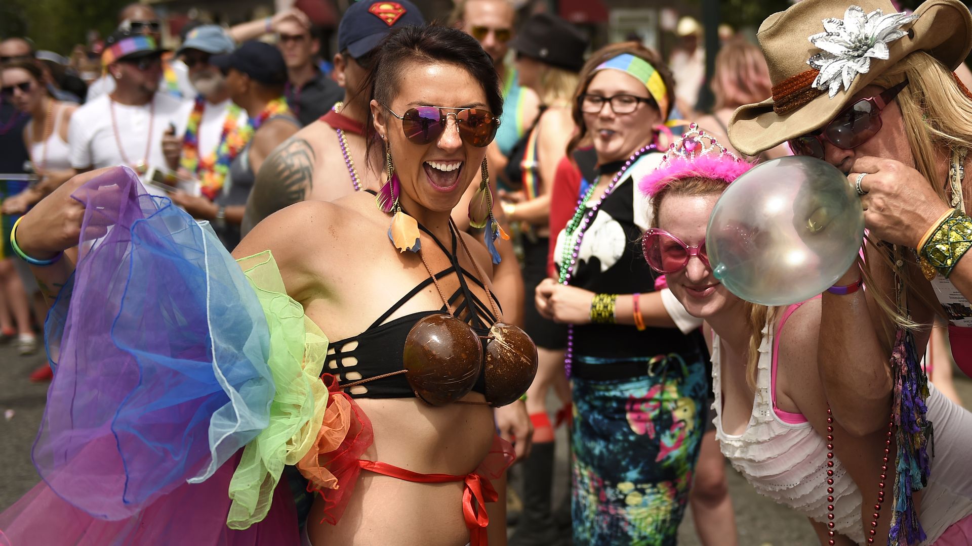 Nikki Robles and Princess Stephanie (far right) in the crowd during the Gay Pride Parade on Colfax Avenue Downtown Denver.