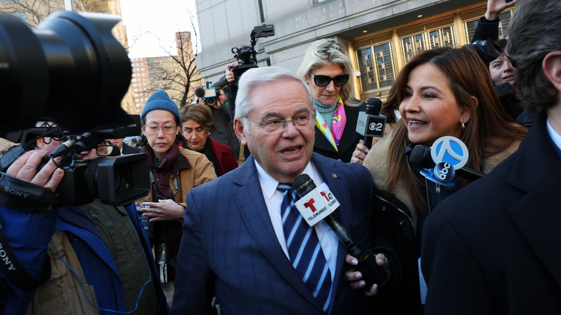 Bob Menendez (D-NJ) is surrounded by media while departing a Manhattan court following an arraignment on new charges in the federal bribery