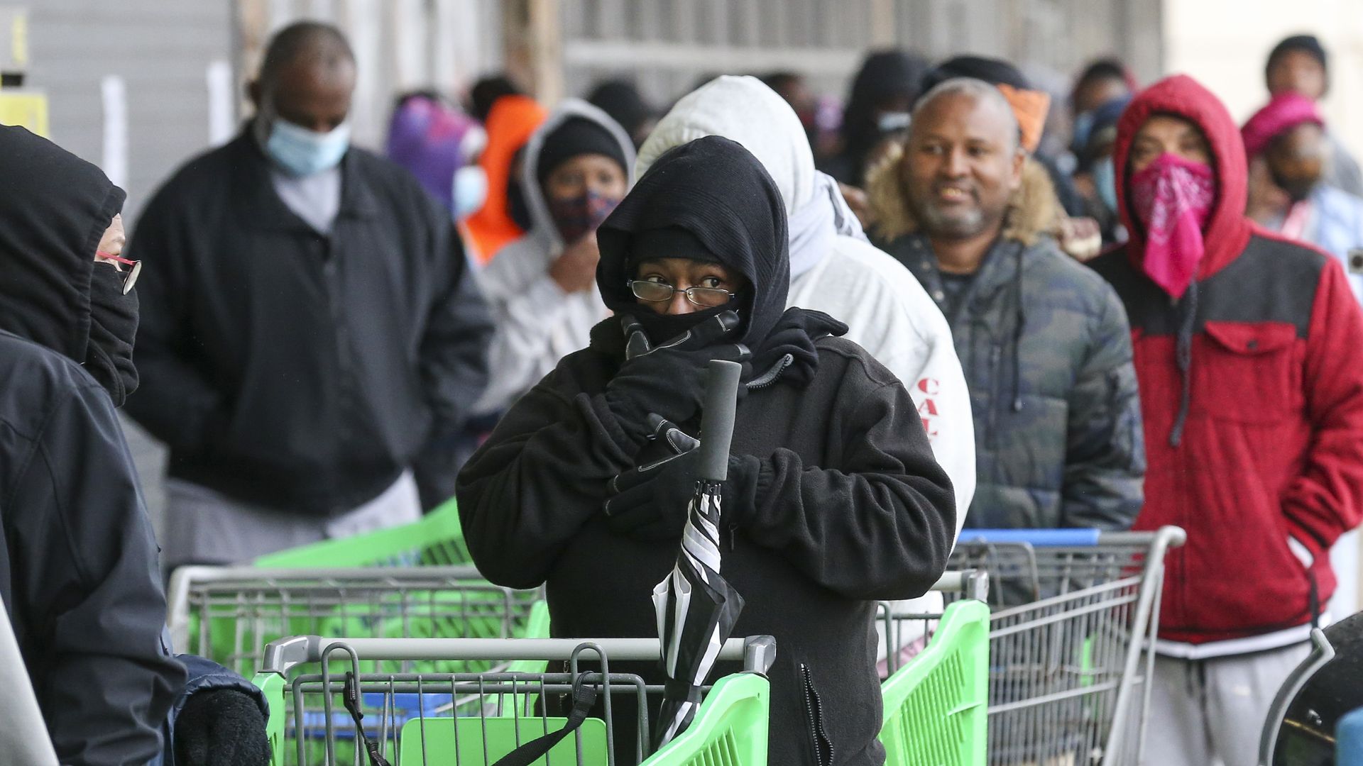 Customers wait in line to enter Frontier Fiesta on February 17, 2021 in Houston, Texas.