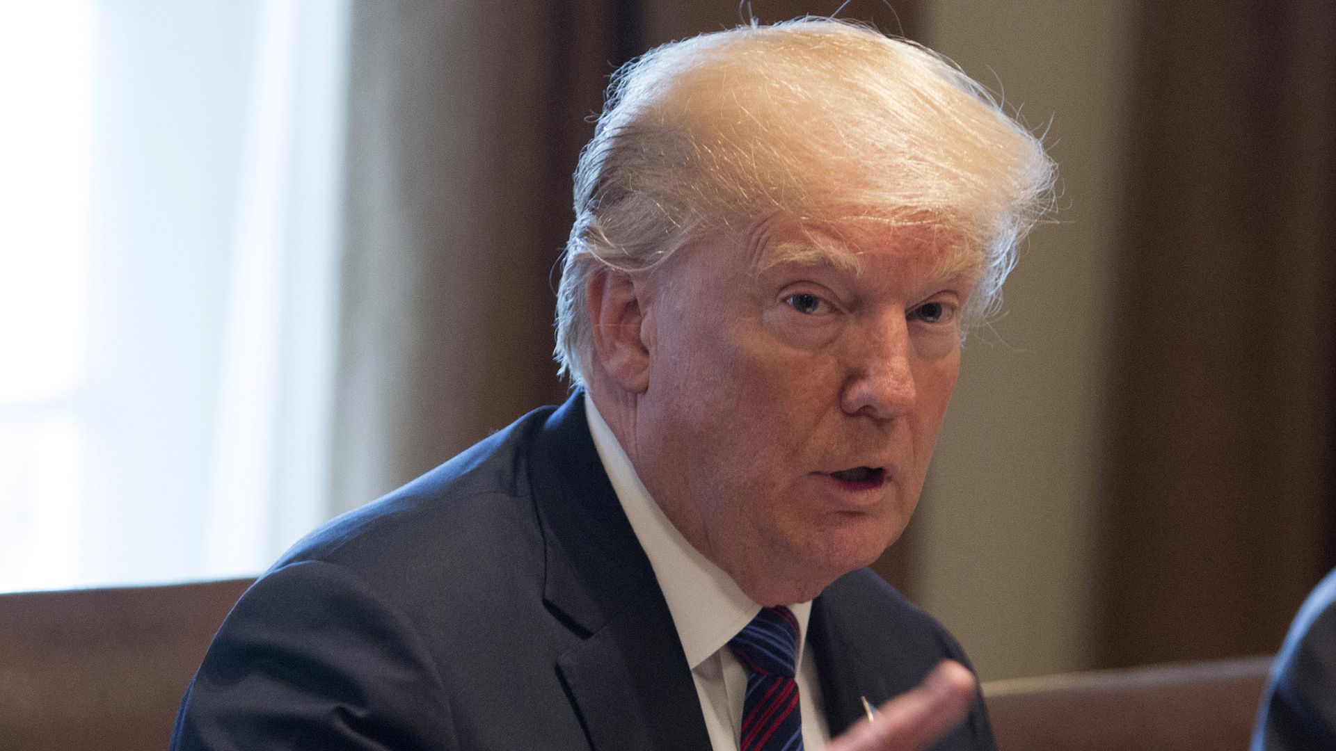 Donald Trump gesturing with pointed finger.