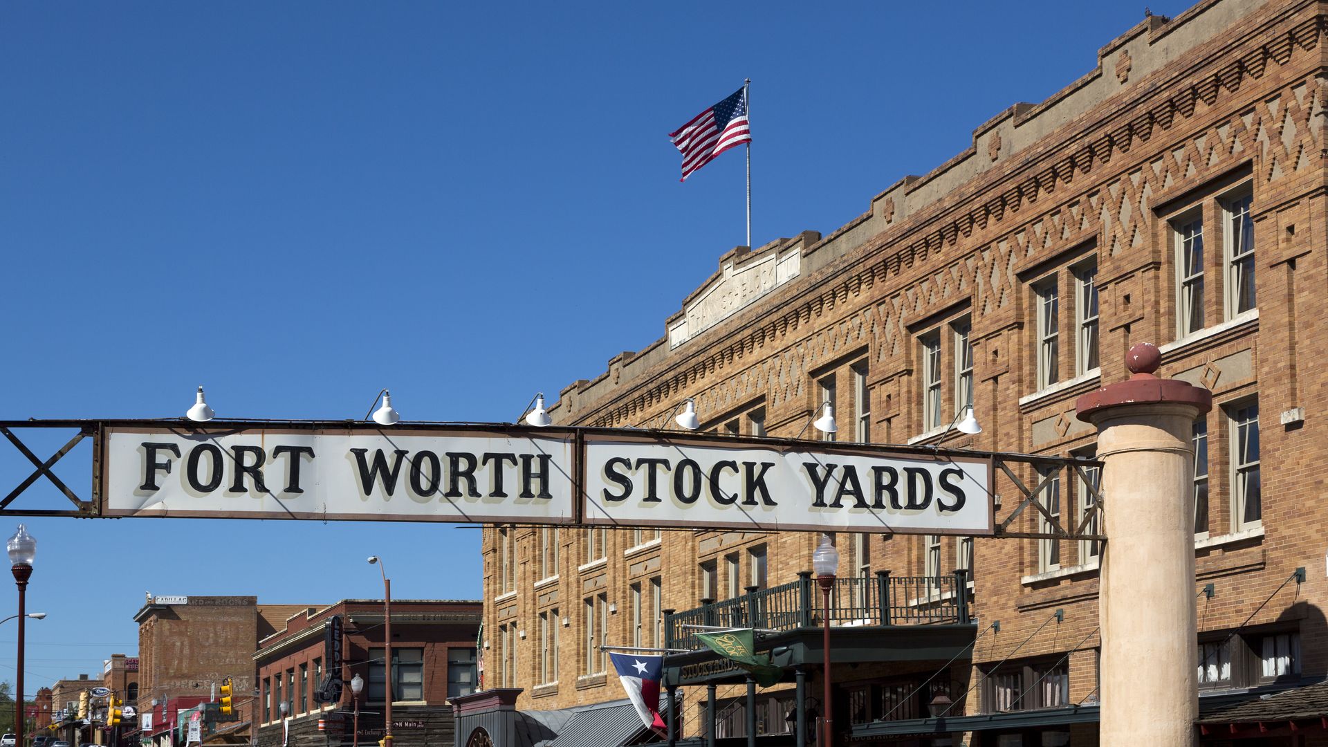 A street sign that reads "Fort Worth Stock Yard"