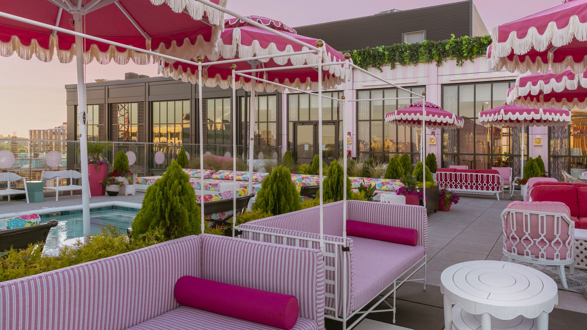 Bright pink benches and awnings on a rooftop
