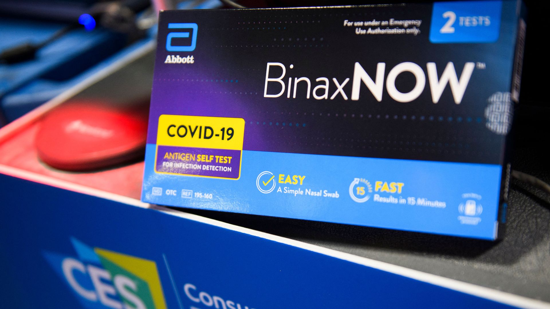 An Abbott BinaxNOW Covid-19 antigen self test is displayed for a photograph before being distributed to conference attendees