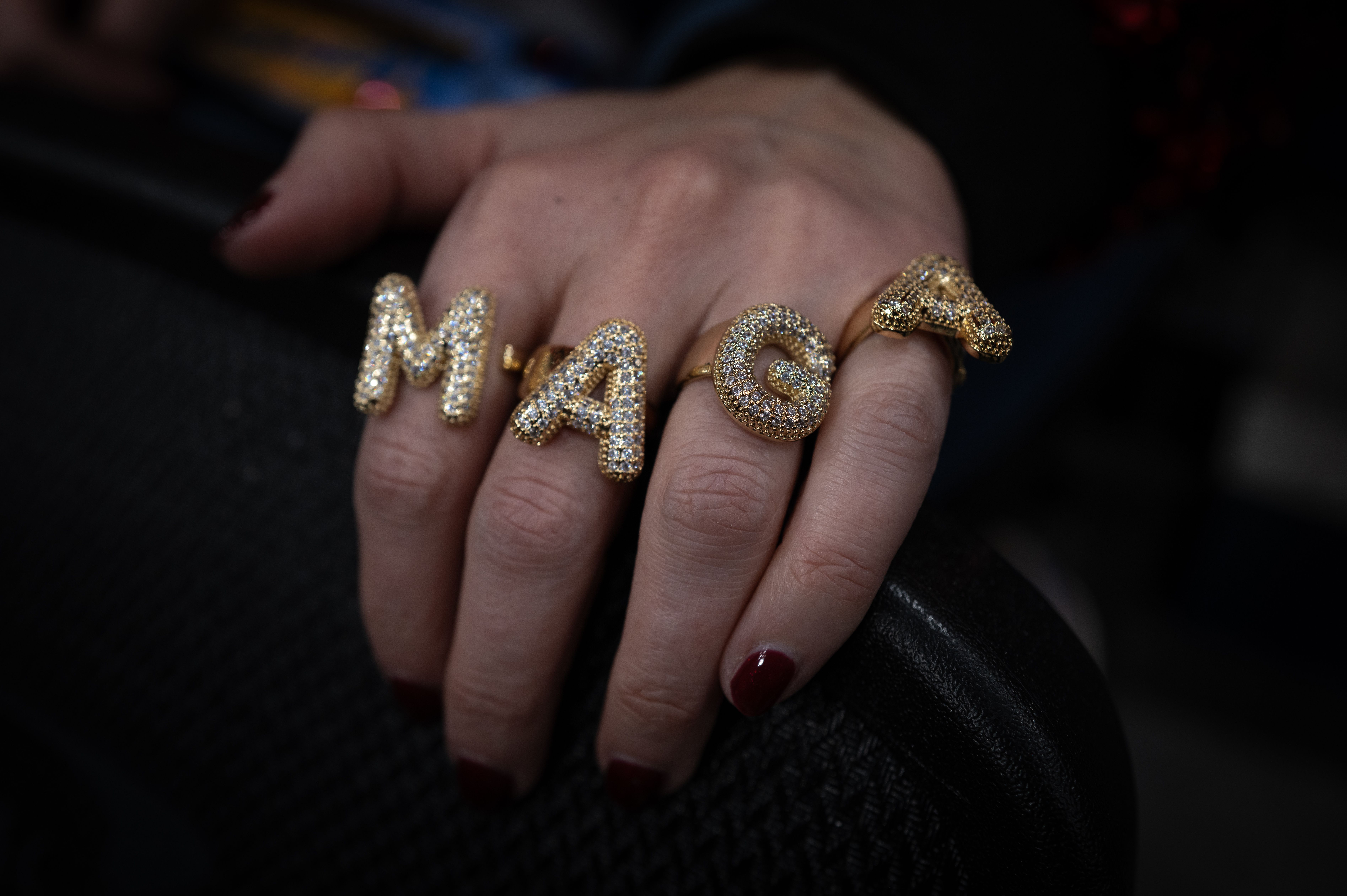 A photo of someone's hand with a "MAGA" ring.