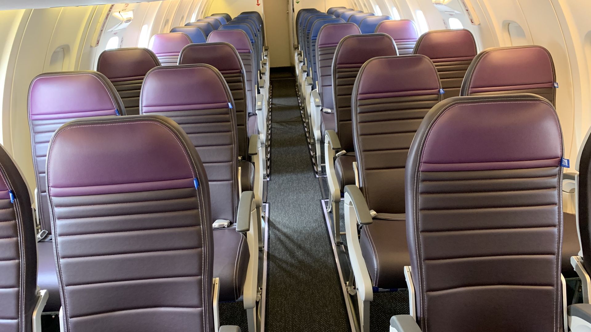 Image of interior of United's new regional jet, with more legroom and storage space