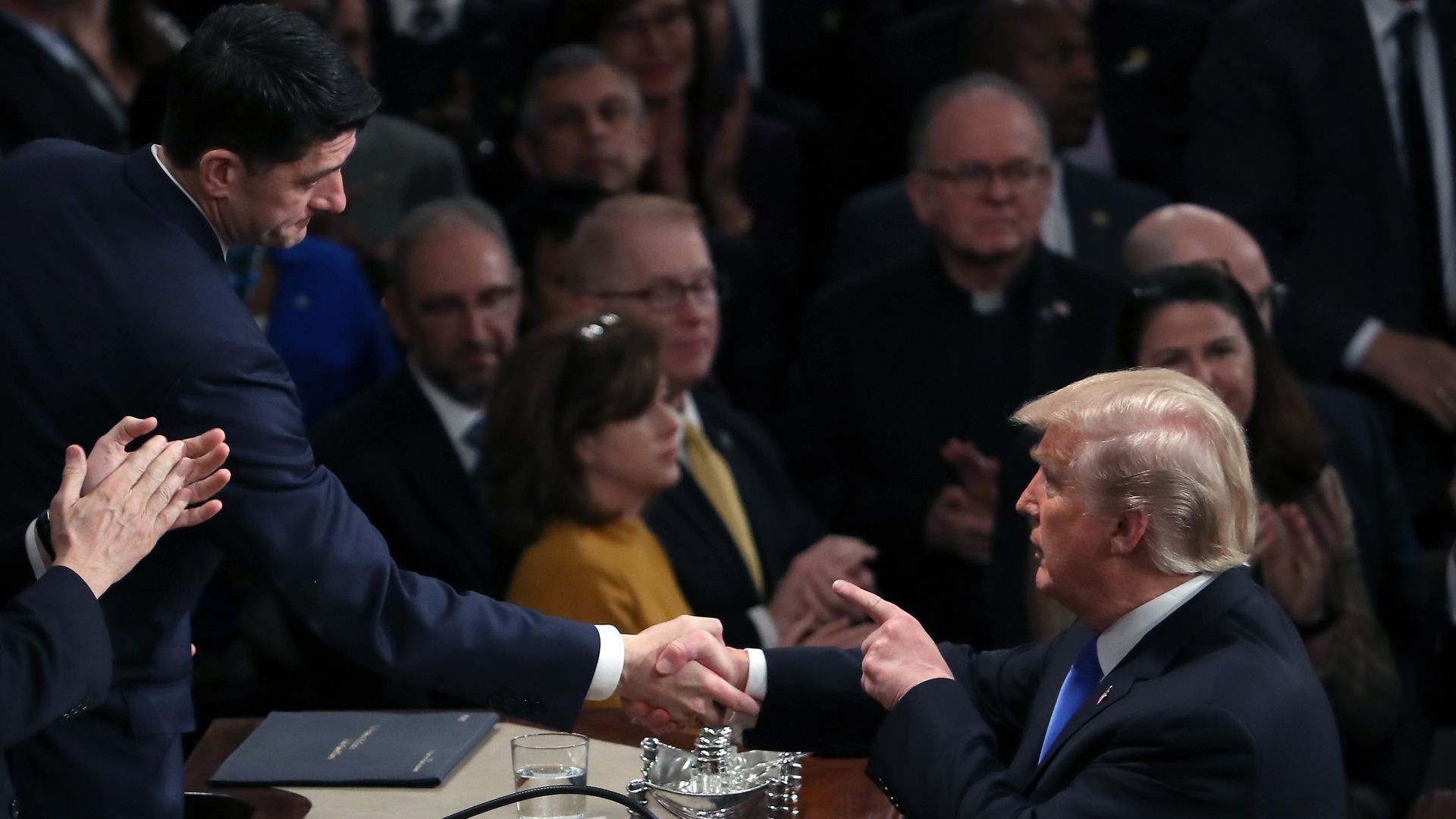 President Donald J. Trump (R) shakes hands with Speaker of the House U.S. Rep. Paul Ryan (R-WI) in the U.S. House of Representatives January 30, 2018 in Washington, DC.