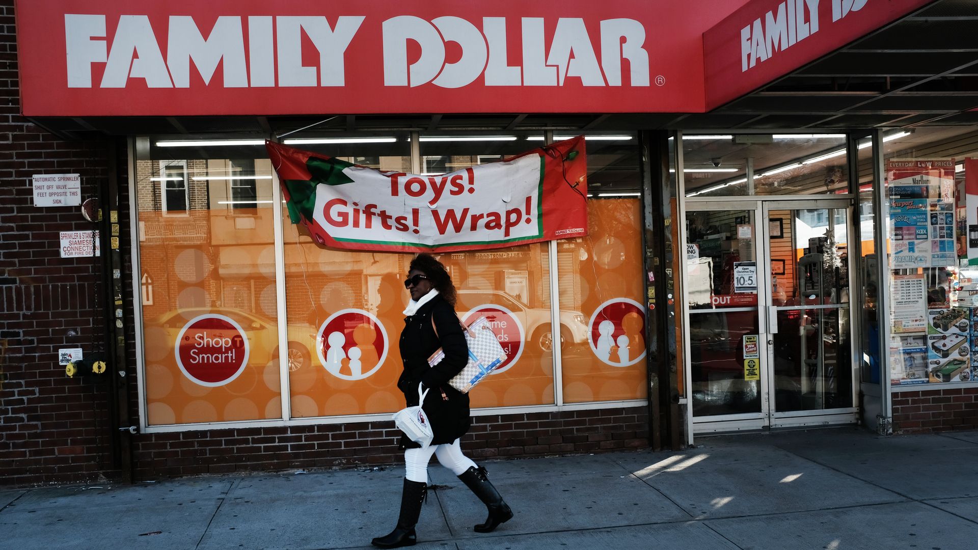A woman talks past a Family Dollar store