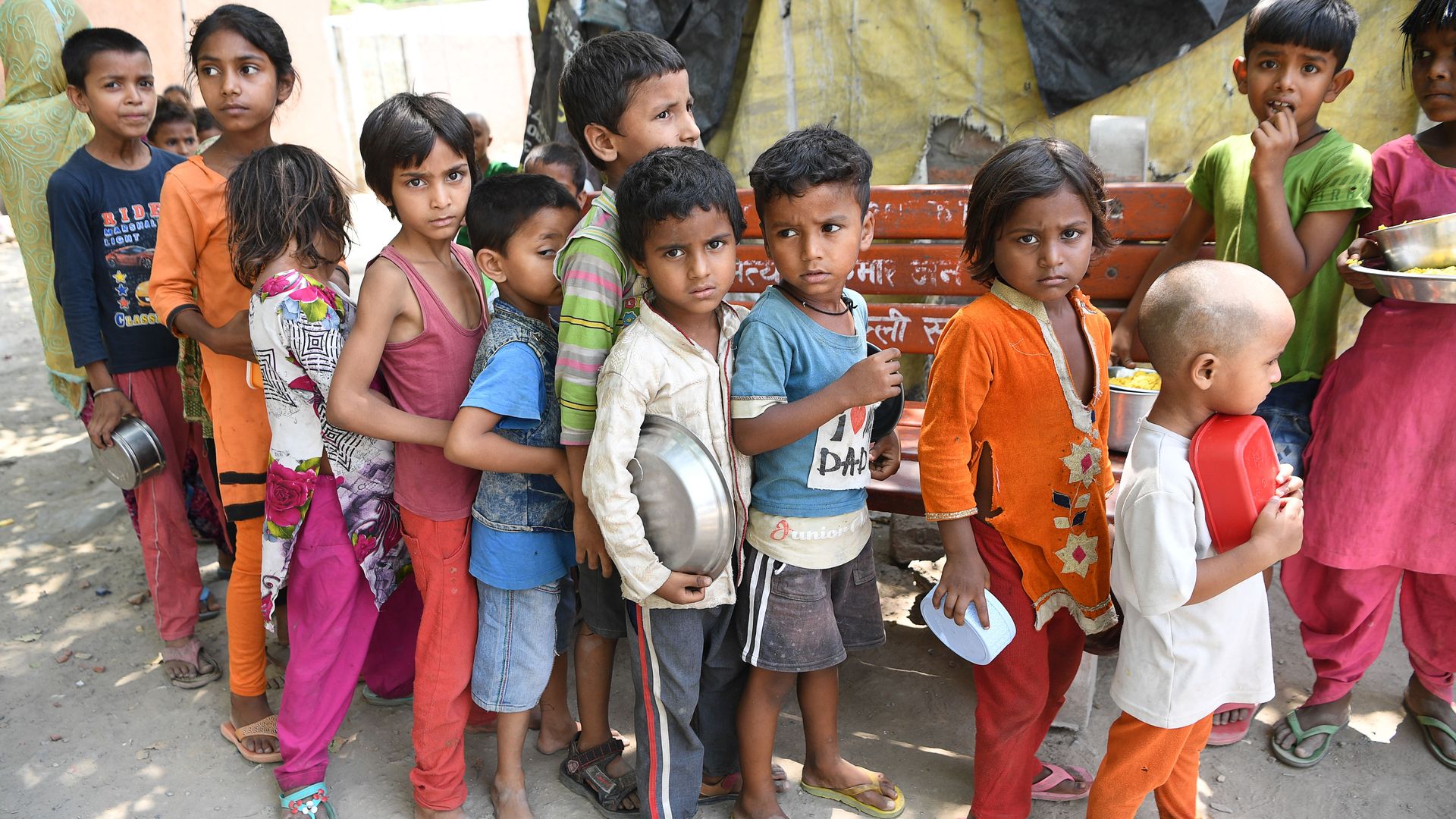 Photo of children in India waiting for food giveaways during the pandemic