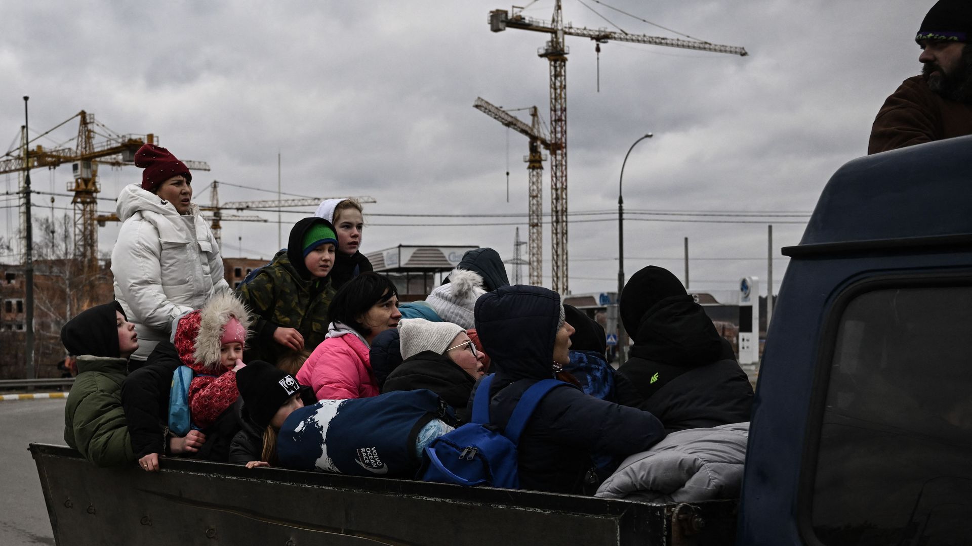 Residents evacuate the city of Irpin, northwest of Kyiv, during heavy shelling and bombing on March 5, 2022. 