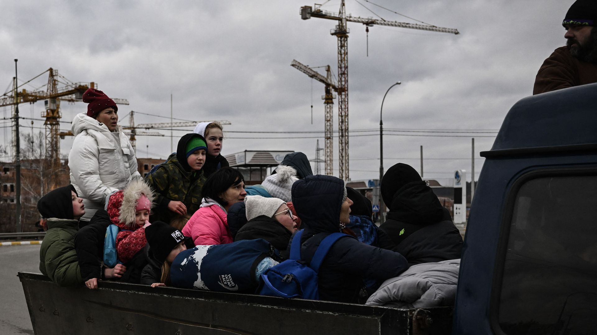 Residents evacuate the city of Irpin, northwest of Kyiv, during heavy shelling and bombing on March 5, 2022.