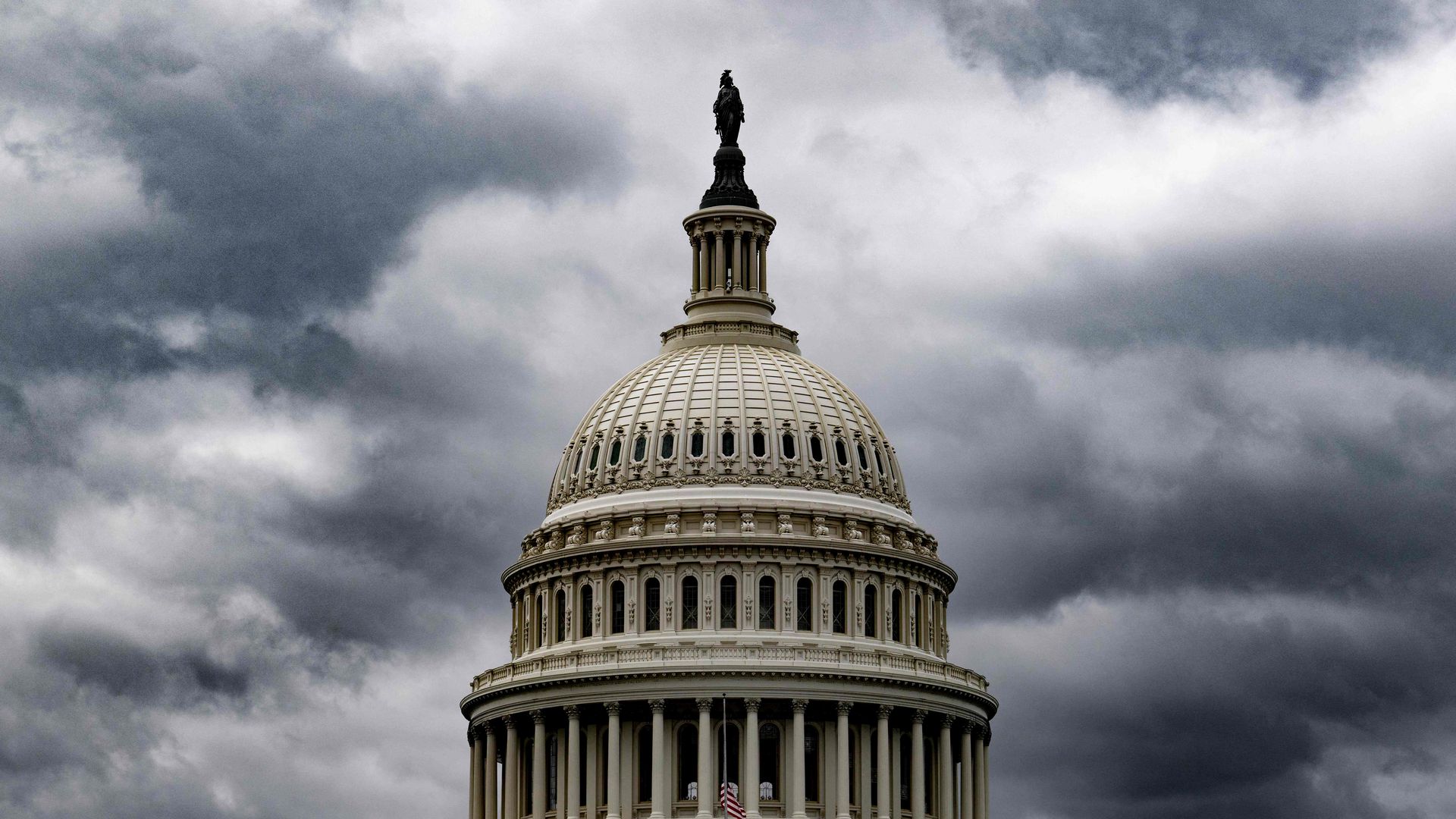 U.S. Capitol with storm clouds