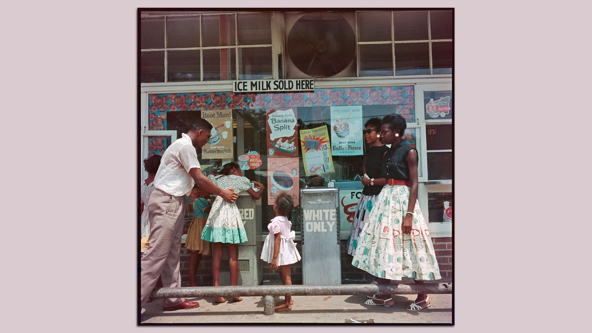 Vintage storefront with an "ICE MILK SOLD HERE" sign, colorful posters on the window, a man helping a girl drinking from a "COLORED ONLY" water fountain, two women in mid-century dresses, and a small child in a white dress beside water fountain labeled "WHITE ONLY."