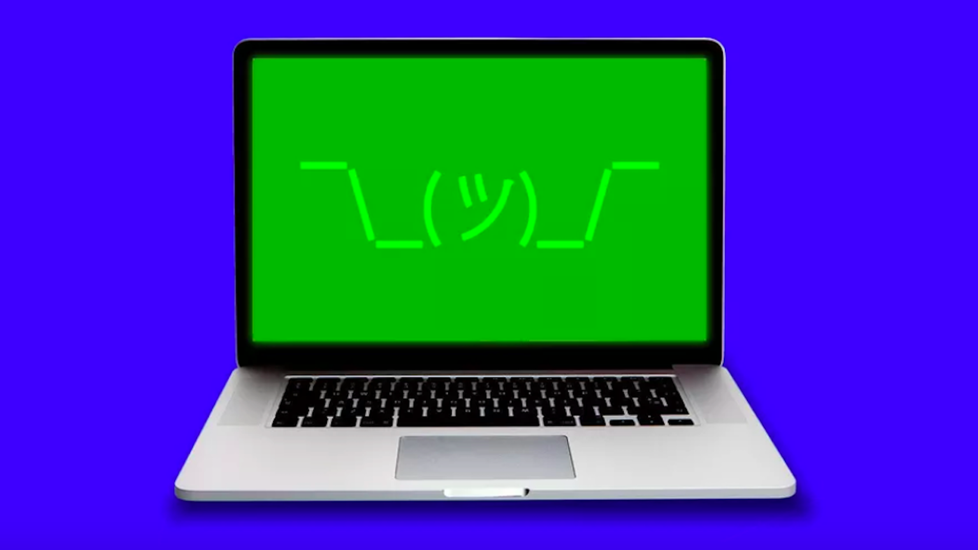 A laptop with a shrugging emoji on the screen