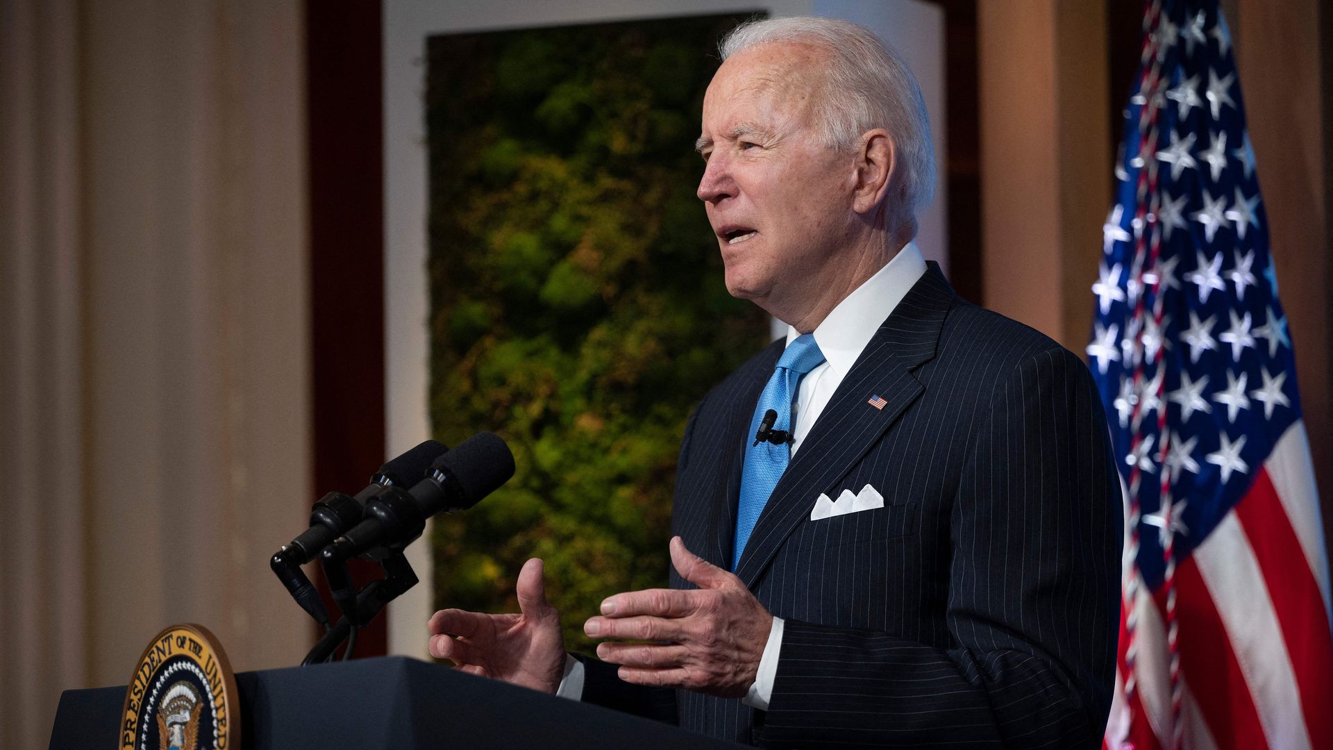 Biden stands at a podium