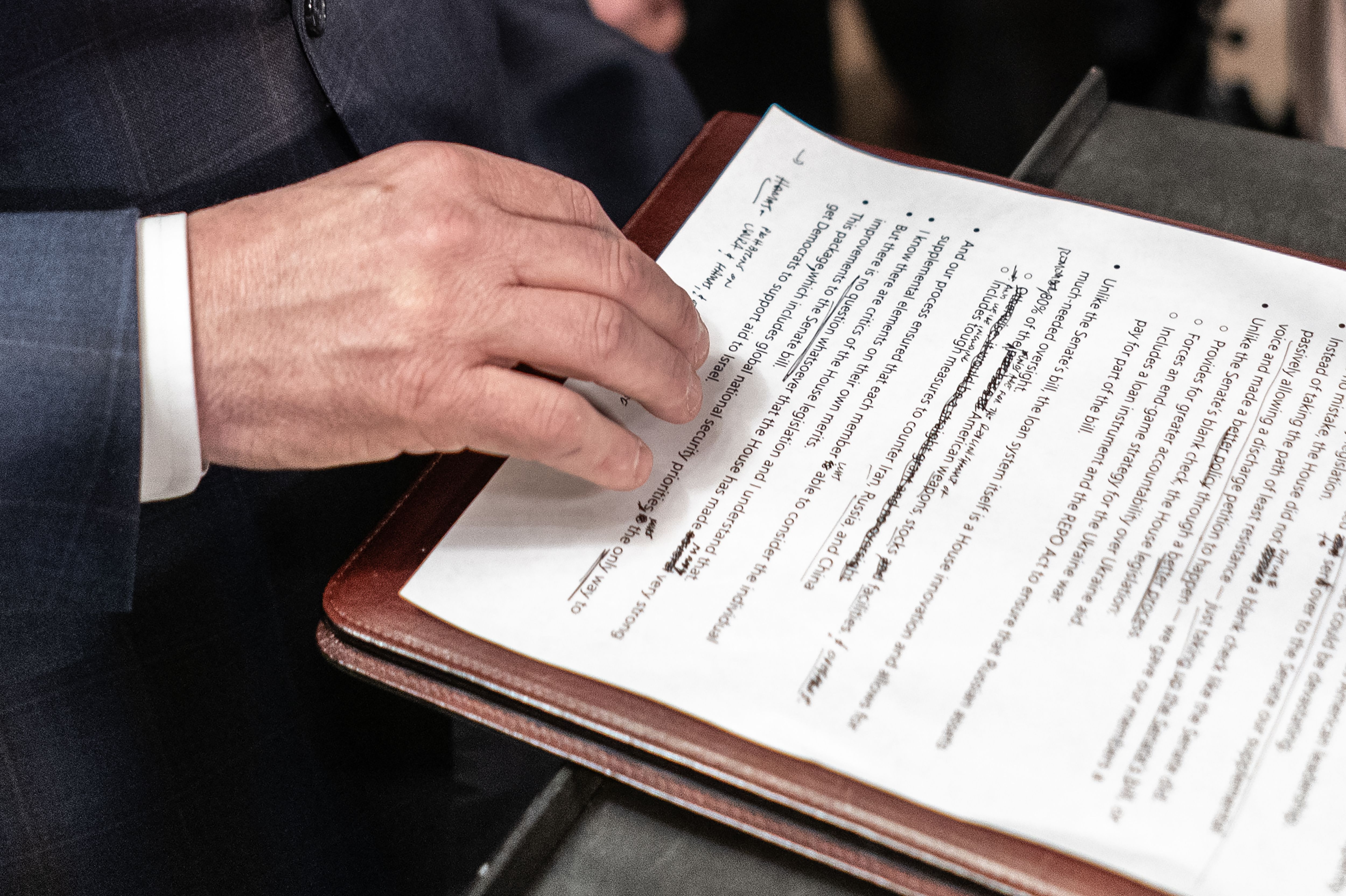  Speaker of the House Mike Johnson (R-LA) reads from his notes 