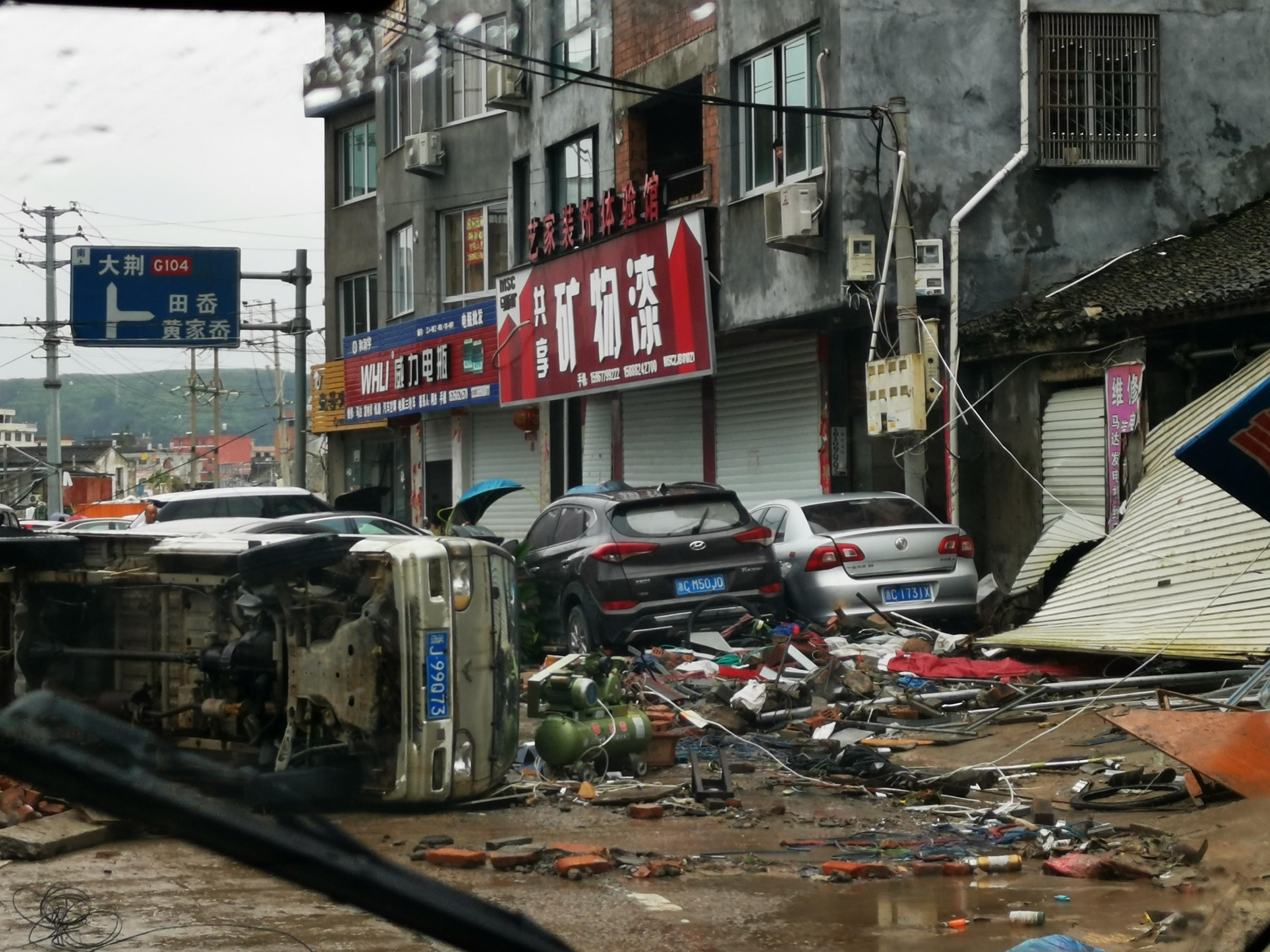  Damaged vehicles are seen in the street on August 10, 2019 in Yueqing, Zhejiang Province of China.