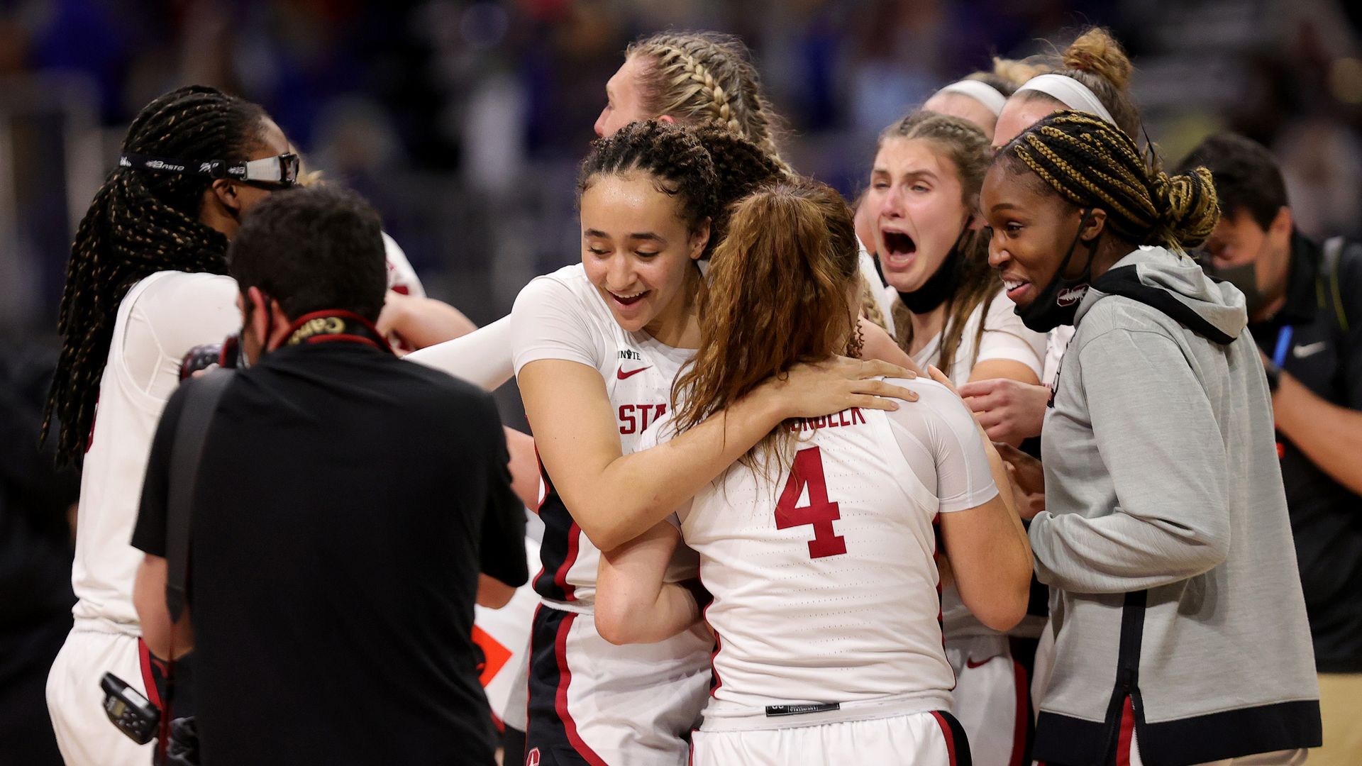 The Stanford Cardinals hug after the team's win against the Arizona Wildcats in the National Championship game of the 2021 NCAA contest at the Alamodome on April 04, 2021 in San Antonio, Texas.