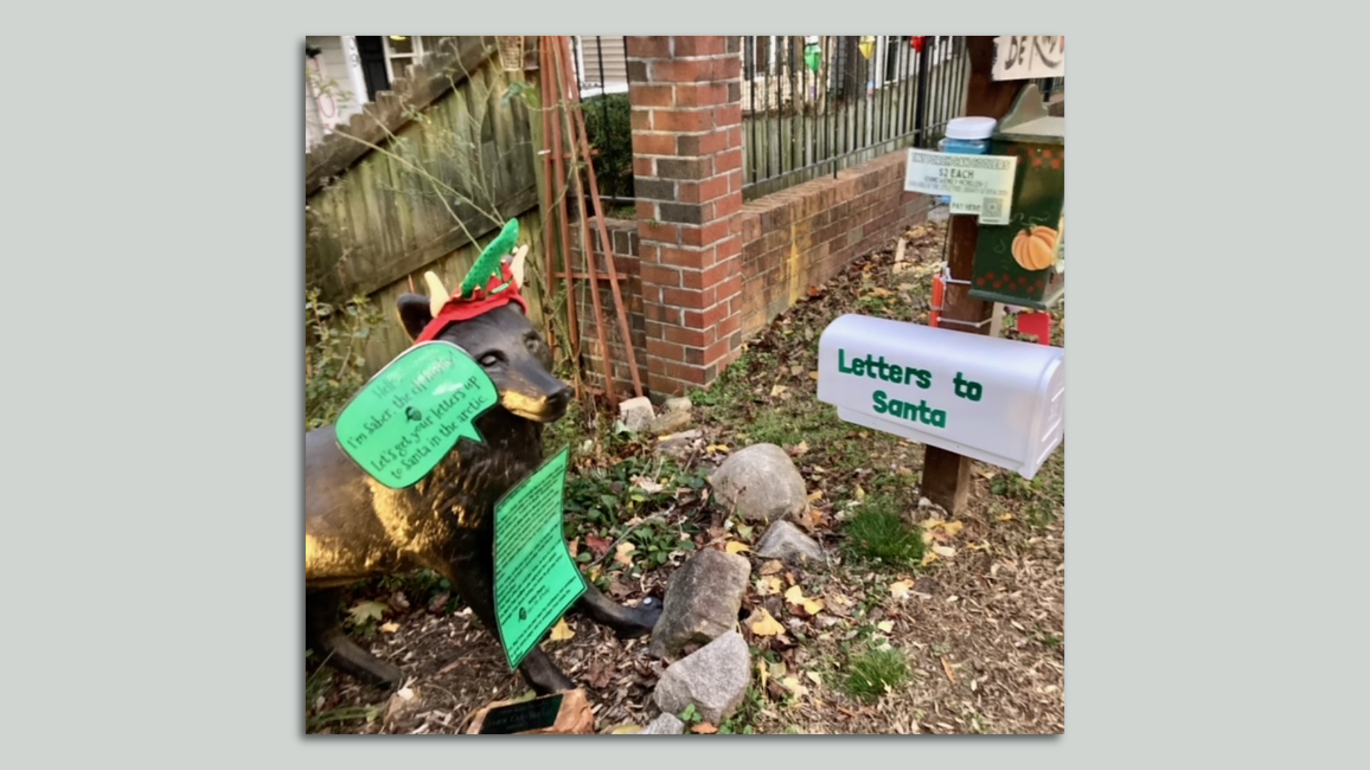 the state of the husky next to a mailbox that says "Letters to Santa"