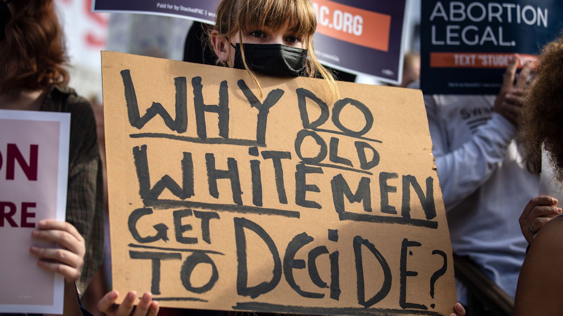 An abortion rights protester holds up a placard in Austin.