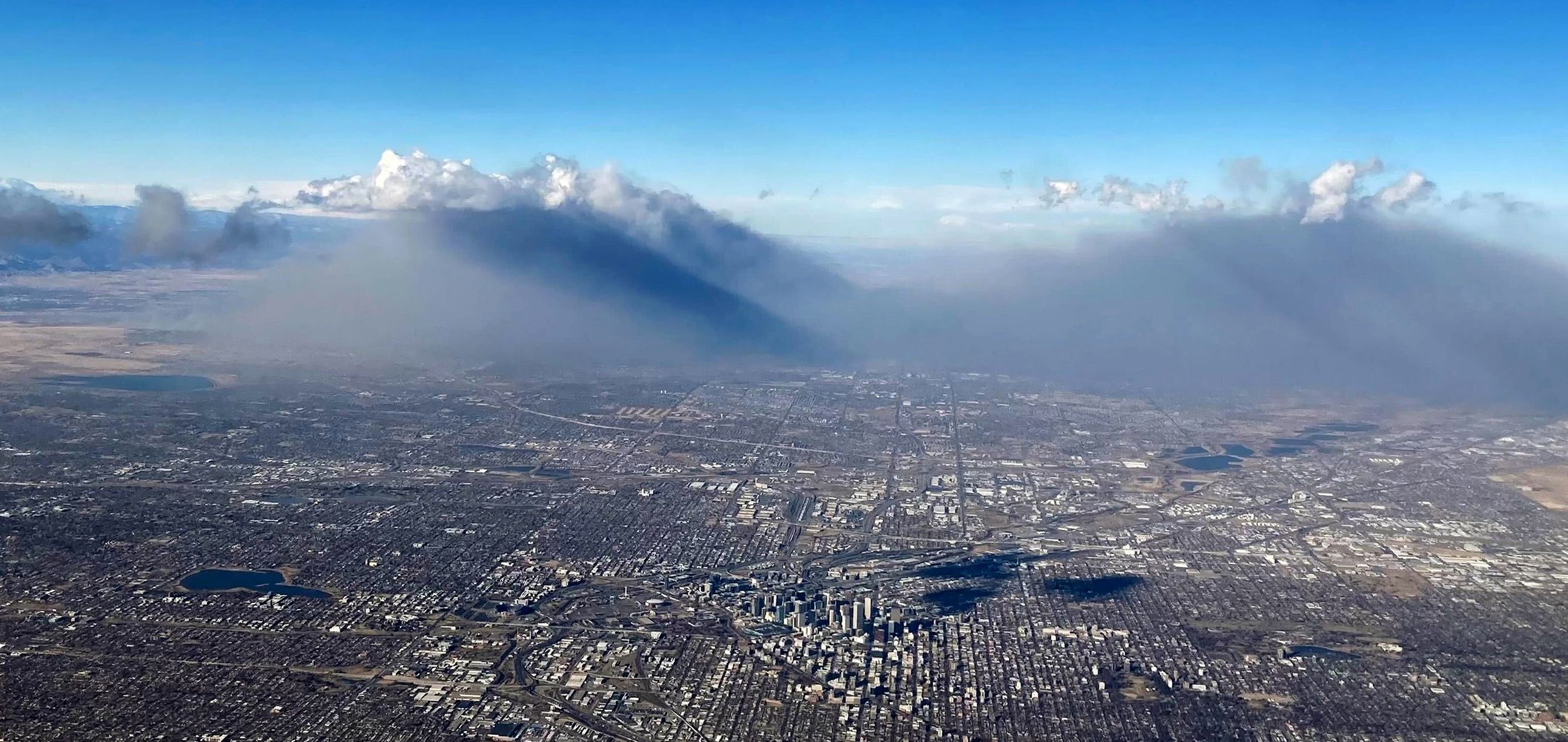 Smoke from wildfires rises into the air north of Denver on Thursday, Dec. 30, 2021. 