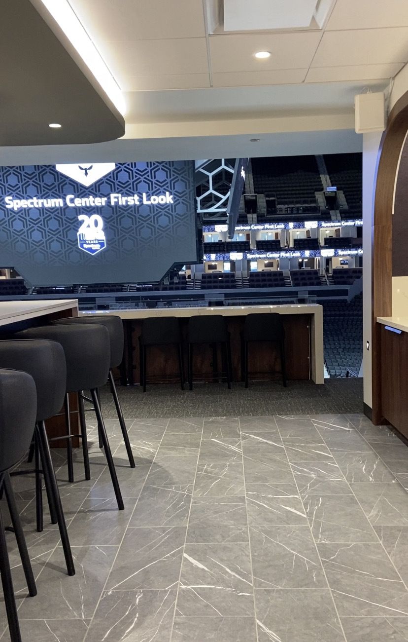 Inside a Founders Level suite at Spectrum Center look out at the jumbotron. 