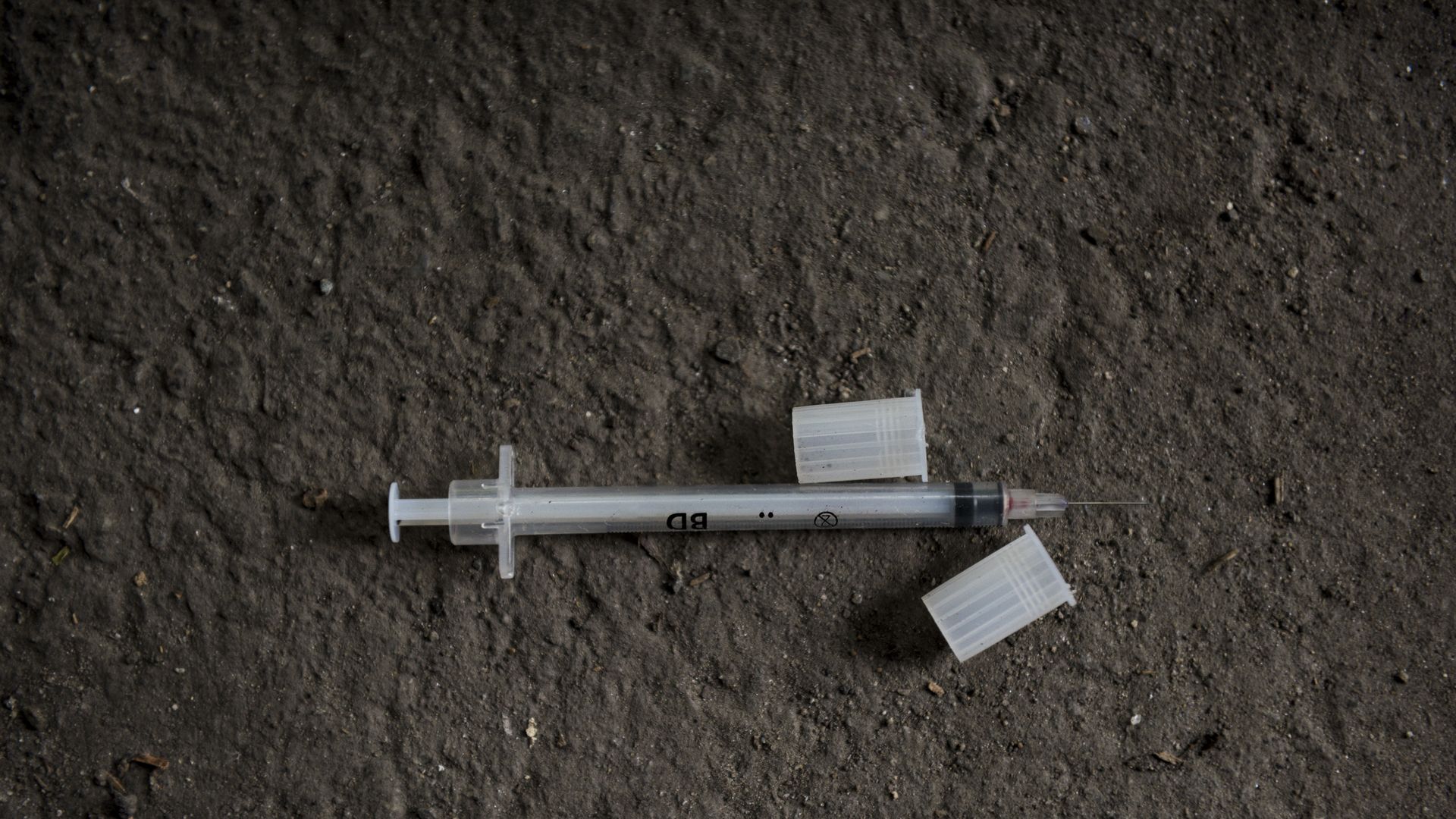 A used syringe under the Joseph W. Casey Bridge in Lawrence, Massachusetts.