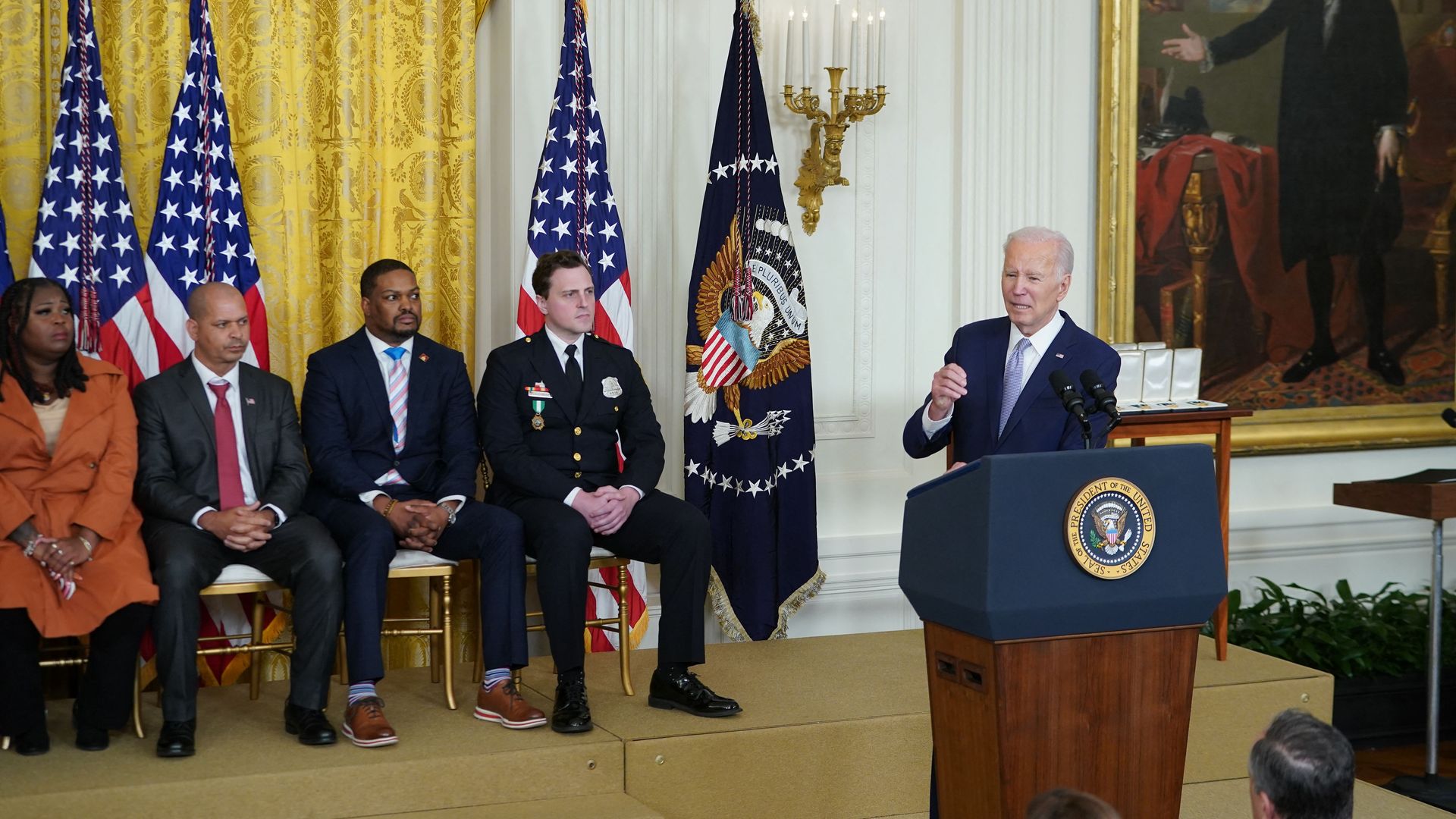 US President Joe Biden (R) speaks on the second anniversary of the January 6, 2021 attack on the US Capitol, at the White House in Washington, DC.