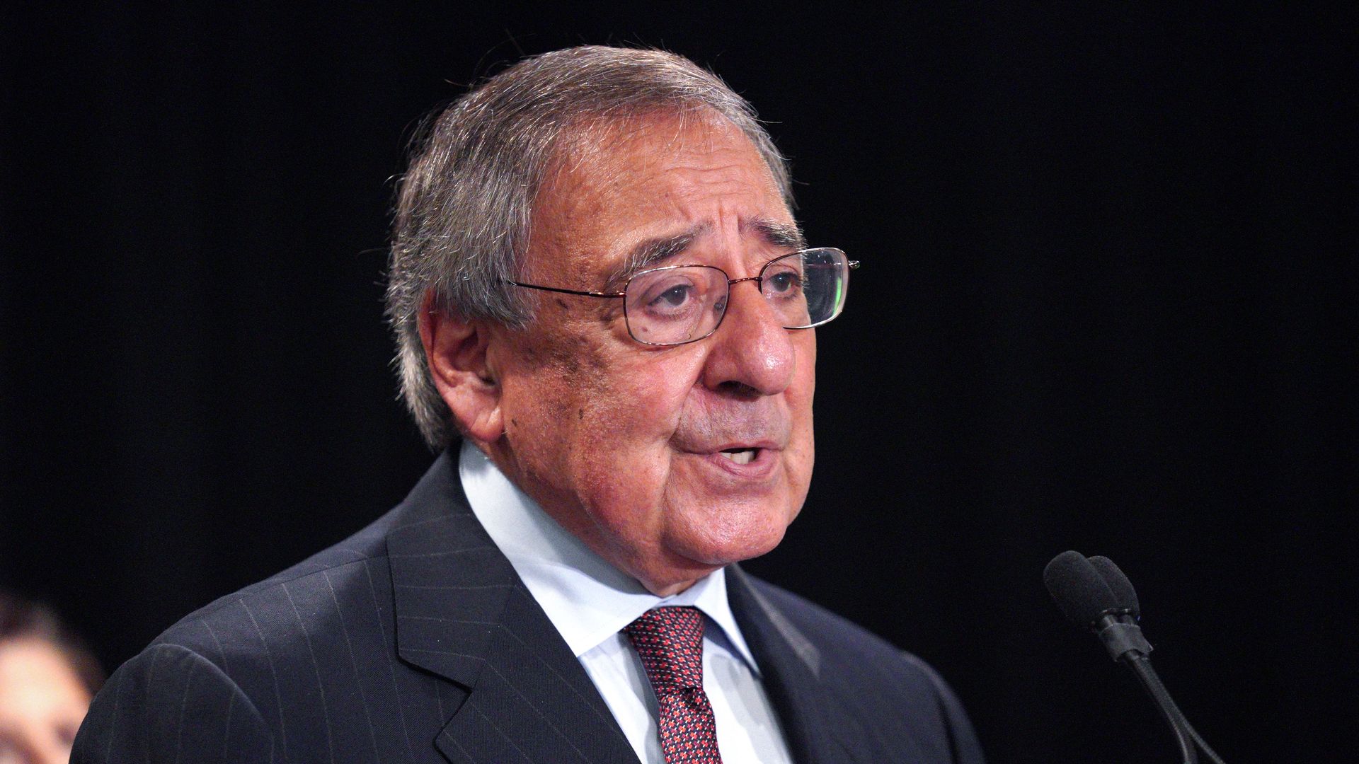 Former Secretary of Defense Leon Panetta speaks at a podium.