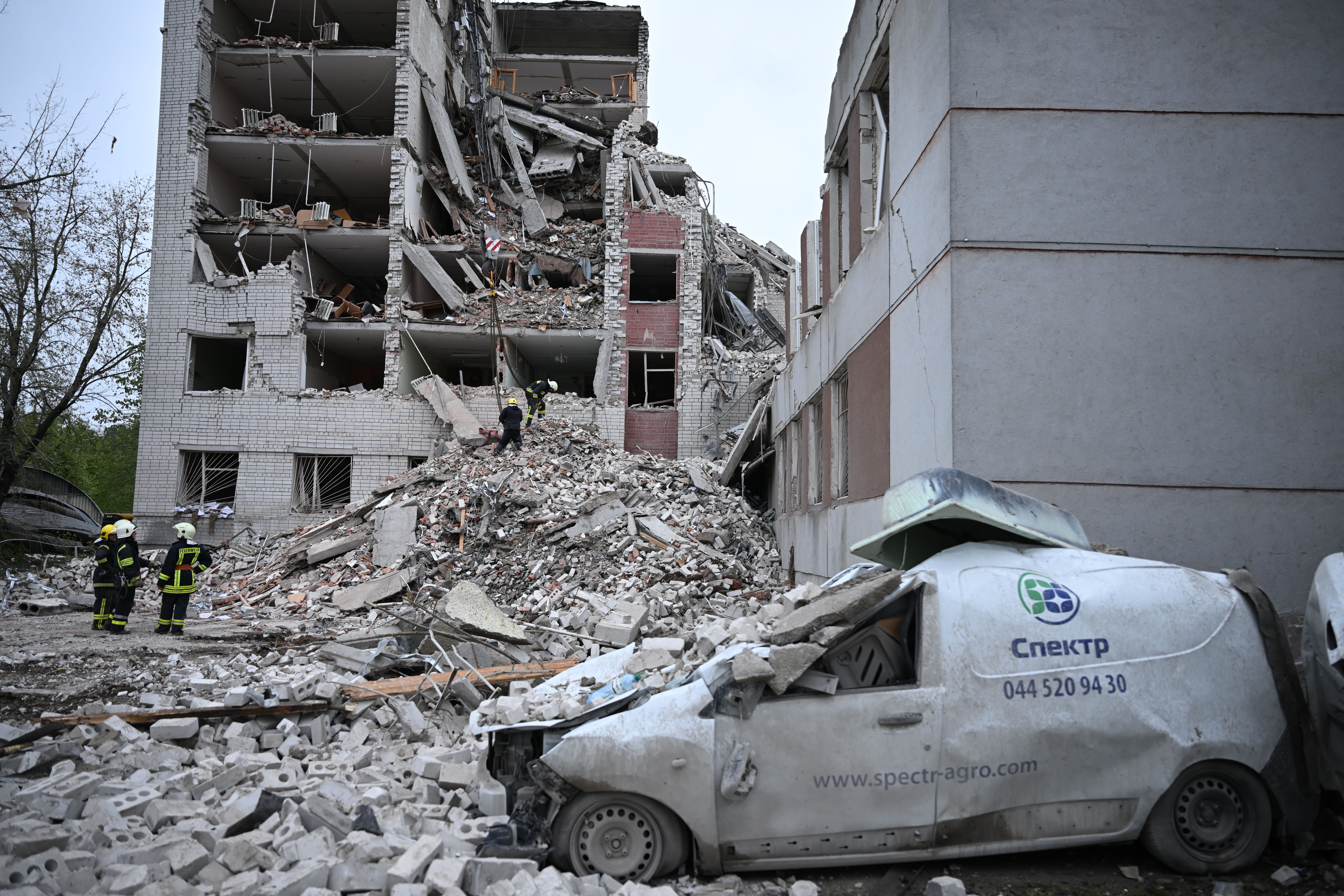 CHERNIHIV, UKRAINE - APRIL 17: Firefighters conduct operations in the rubble of heavily damaged building, part of which collapsed, following the Russian missile attack on Chernihiv, Ukraine on April 17, 2024. It was reported that 14 people died and 61 people were injured in Russia's missile attack on Chernihiv. (Photo by Viacheslav Ratynskyi/Anadolu via Getty Images)