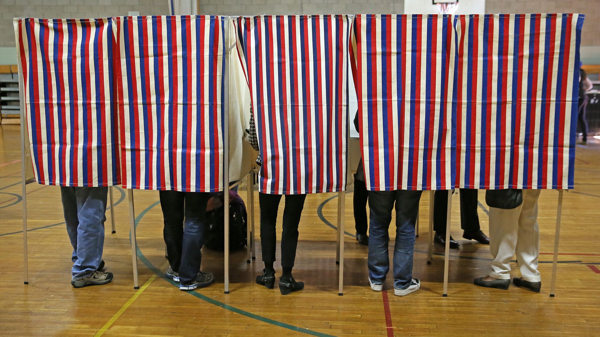 People vote in the 2016 election at the Graham and Parks School in Cambridge, Mass.,
