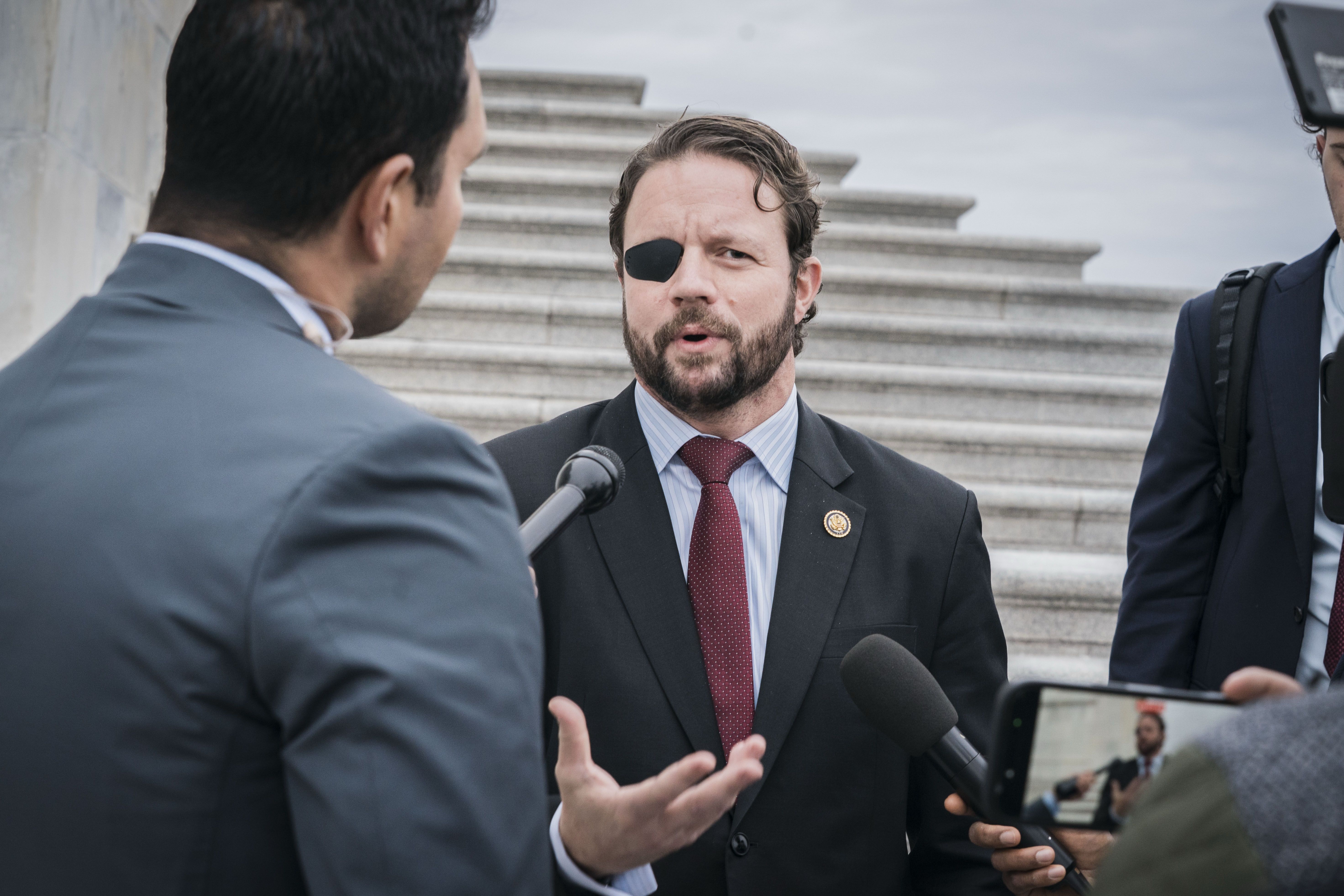 Rep. Dan Crenshaw (R-Texas) on the steps of the Capitol in December. 