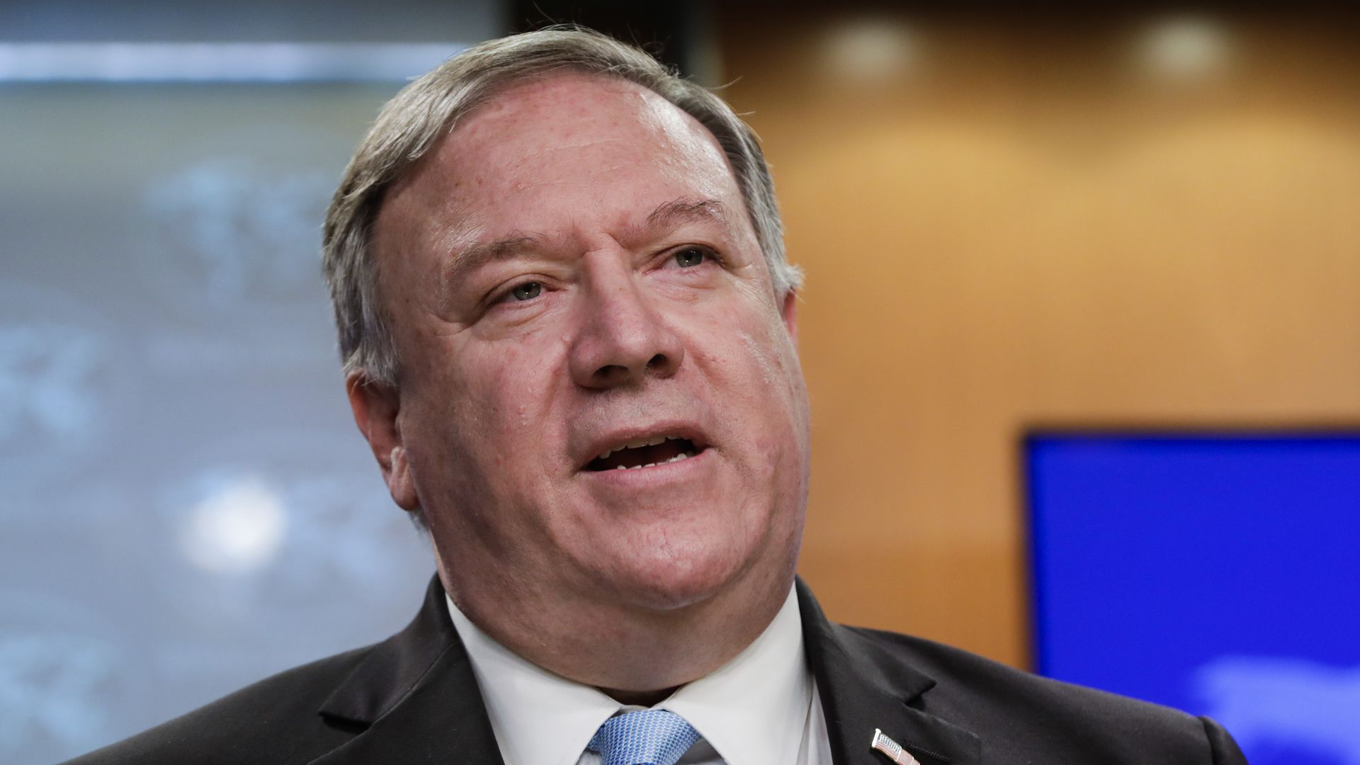 Pompeo in a suit and tie