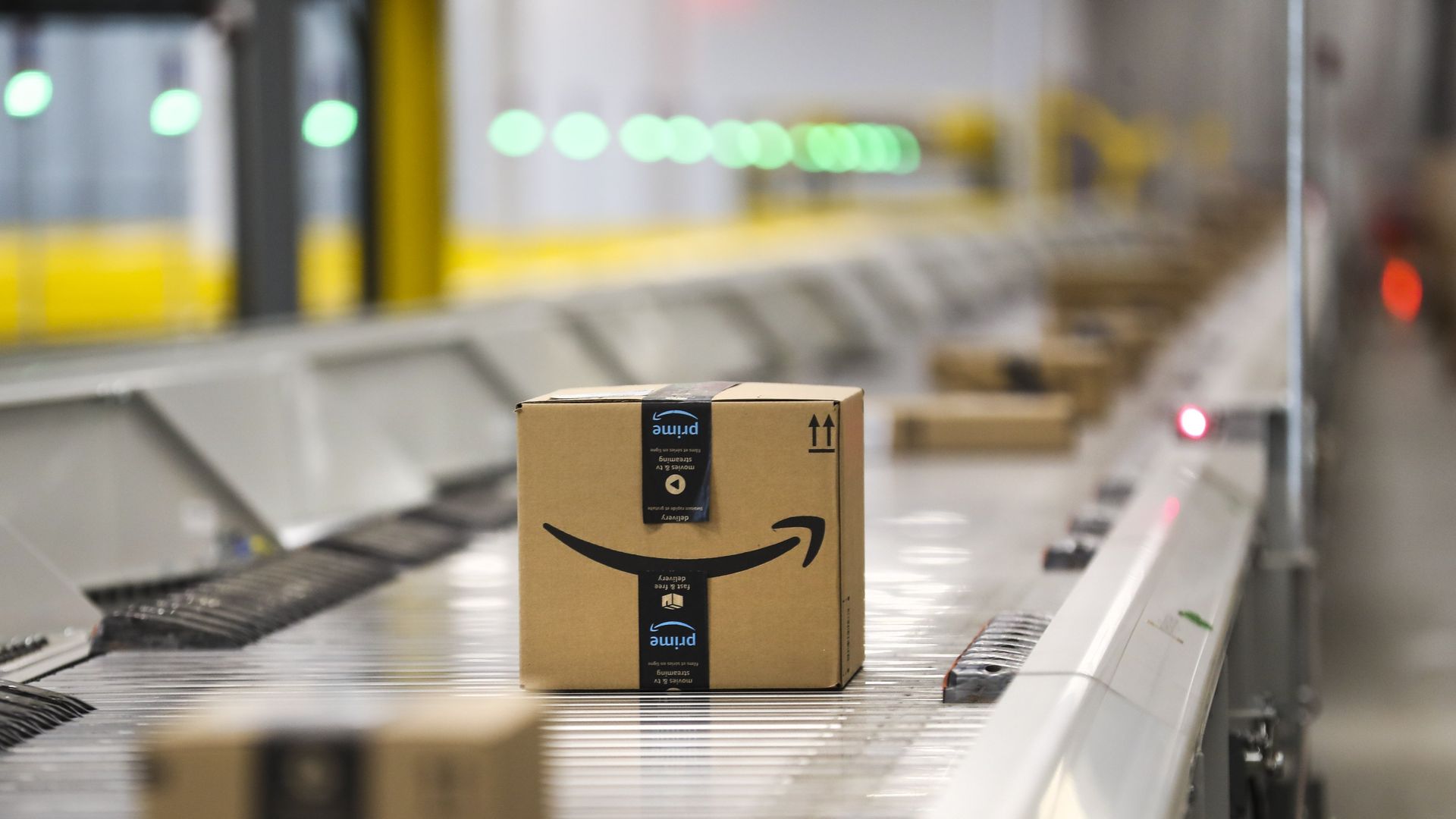 Amazon boxes on a conveyor belt.