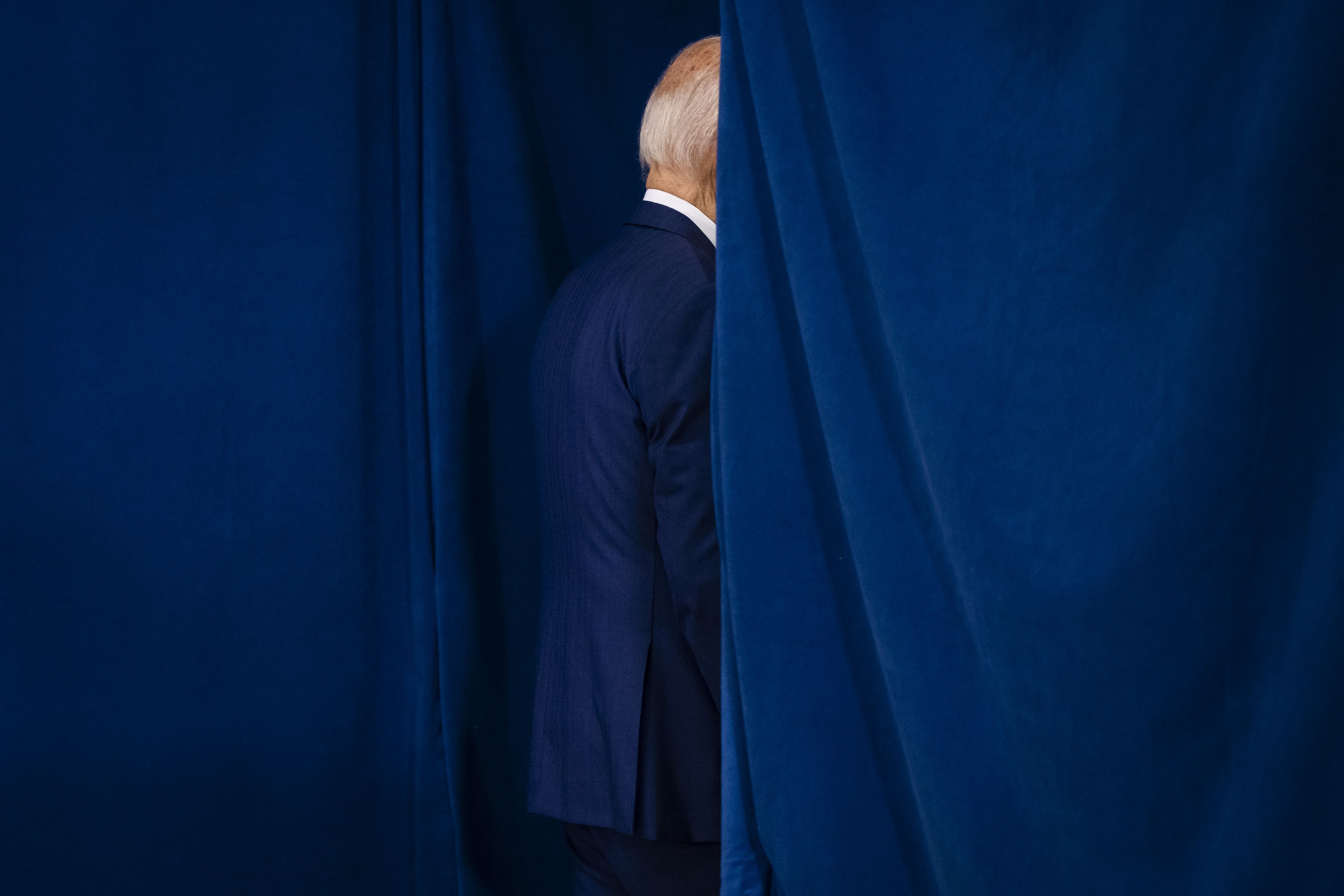 President Biden leaves the stage after giving comments on the rally. 