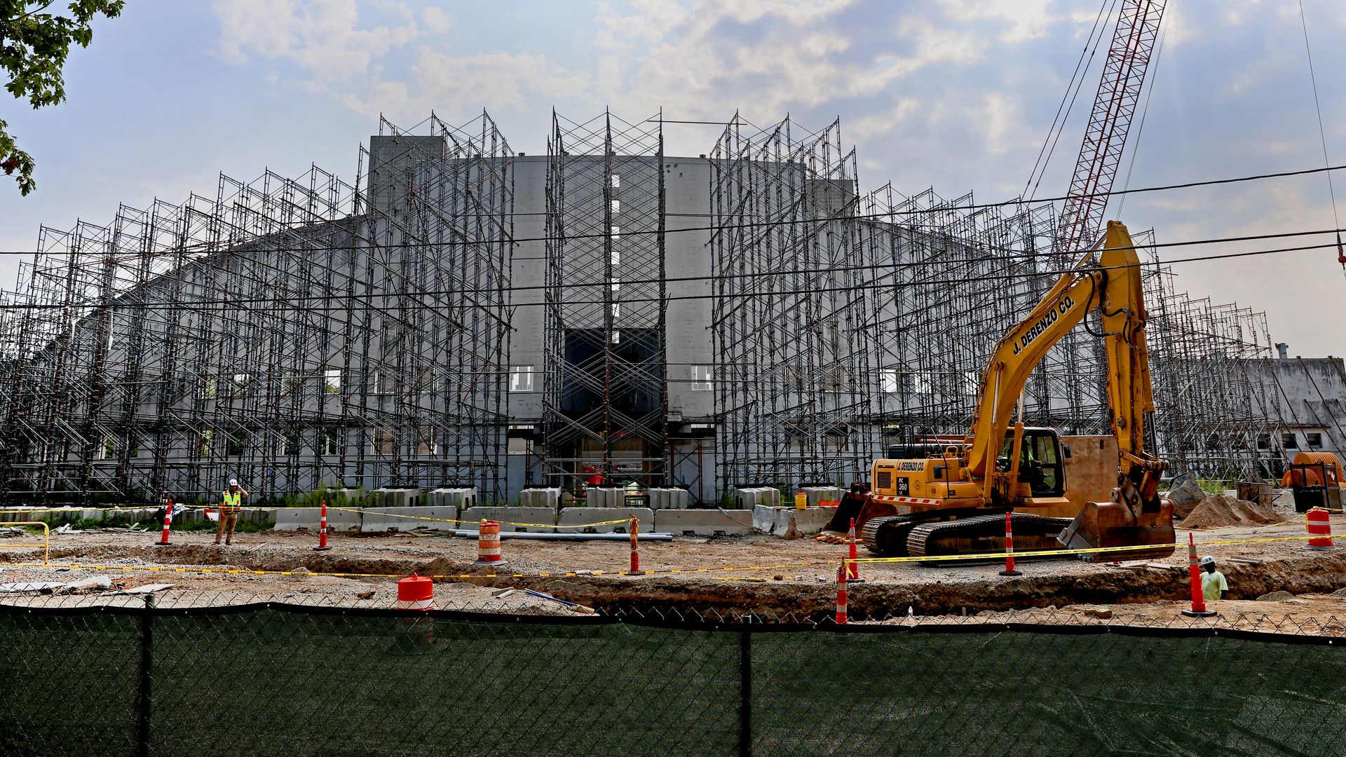 Construction equipment, orange cones and scaffolding surrounds White Stadium in Franklin Park in Boston. 