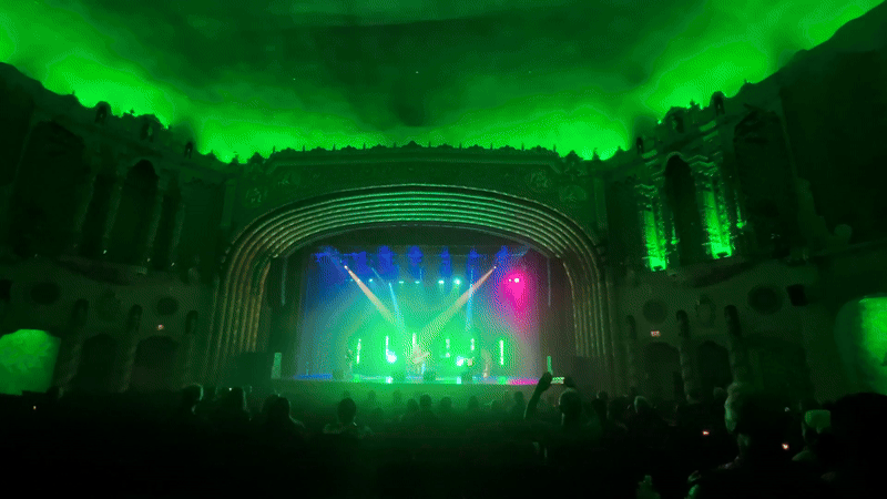A gif of a concert with a light show. 