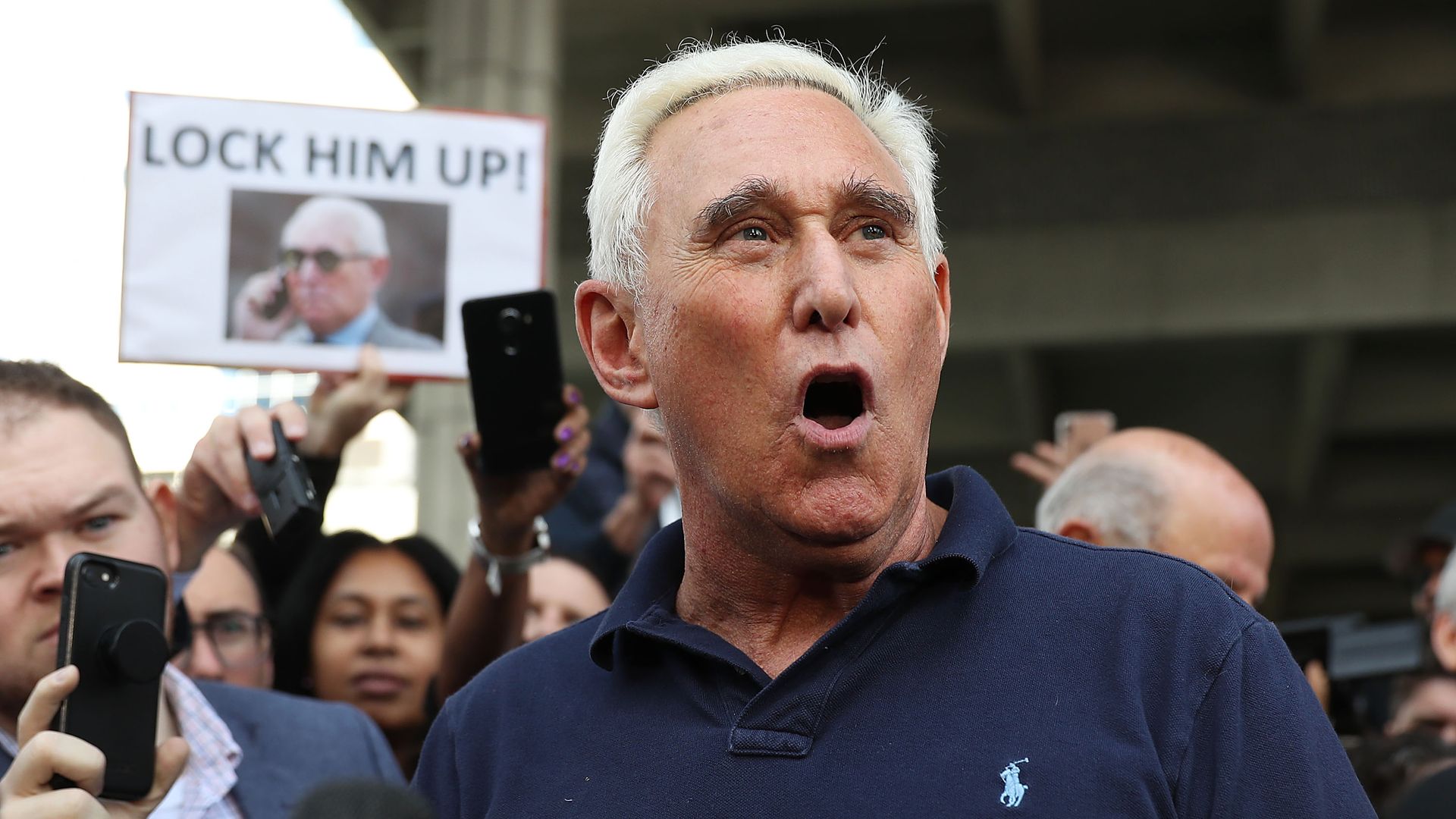 Roger Stone speaks to a crowd after his arrest