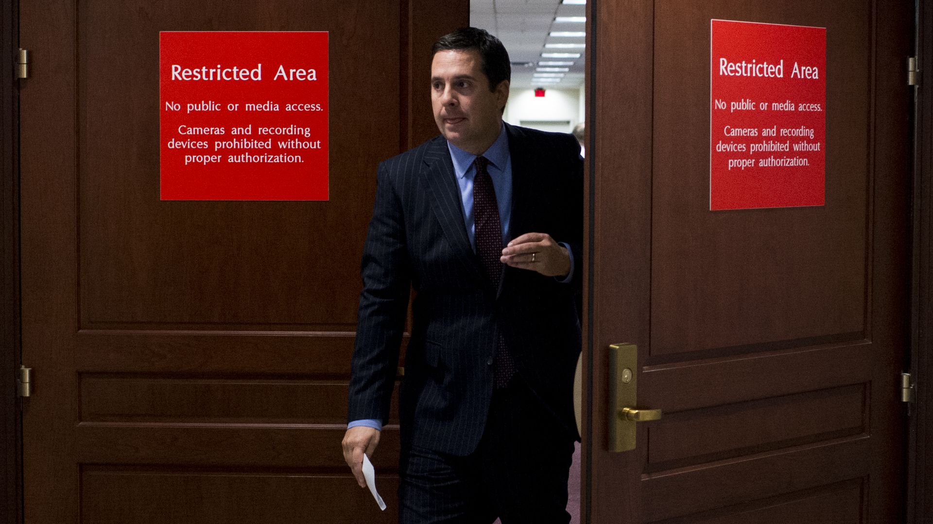 Devin Nunes exits a restricted area for the House Intelligence Committee's offices