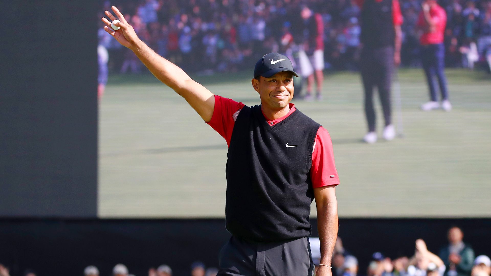 Tiger Woods of the United States celebrates winning the tournament on the 18th green during the final round of the Zozo Championship at Accordia Golf Narashino Country Club on October 28