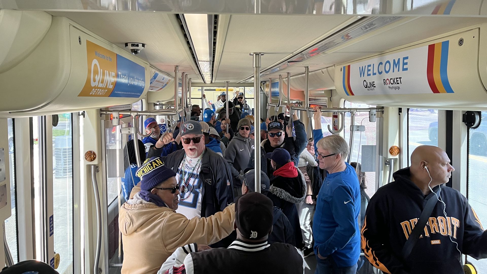 The QLine is busy with tons of riders, many in sports attire.