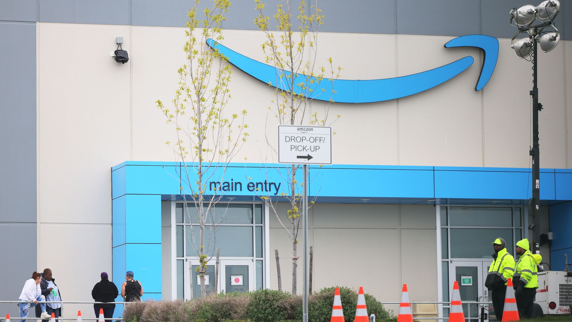 People congregate outside of the LDJ5 Amazon Sort Center on April 25, 2022 in New York City.