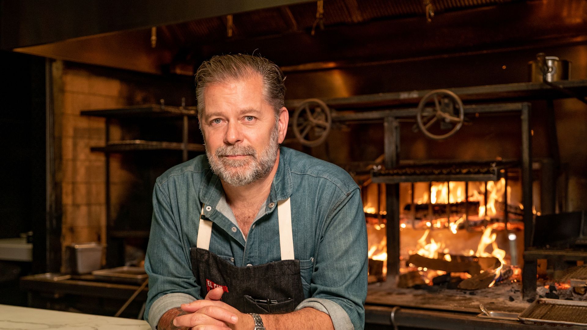 guy in front of fire