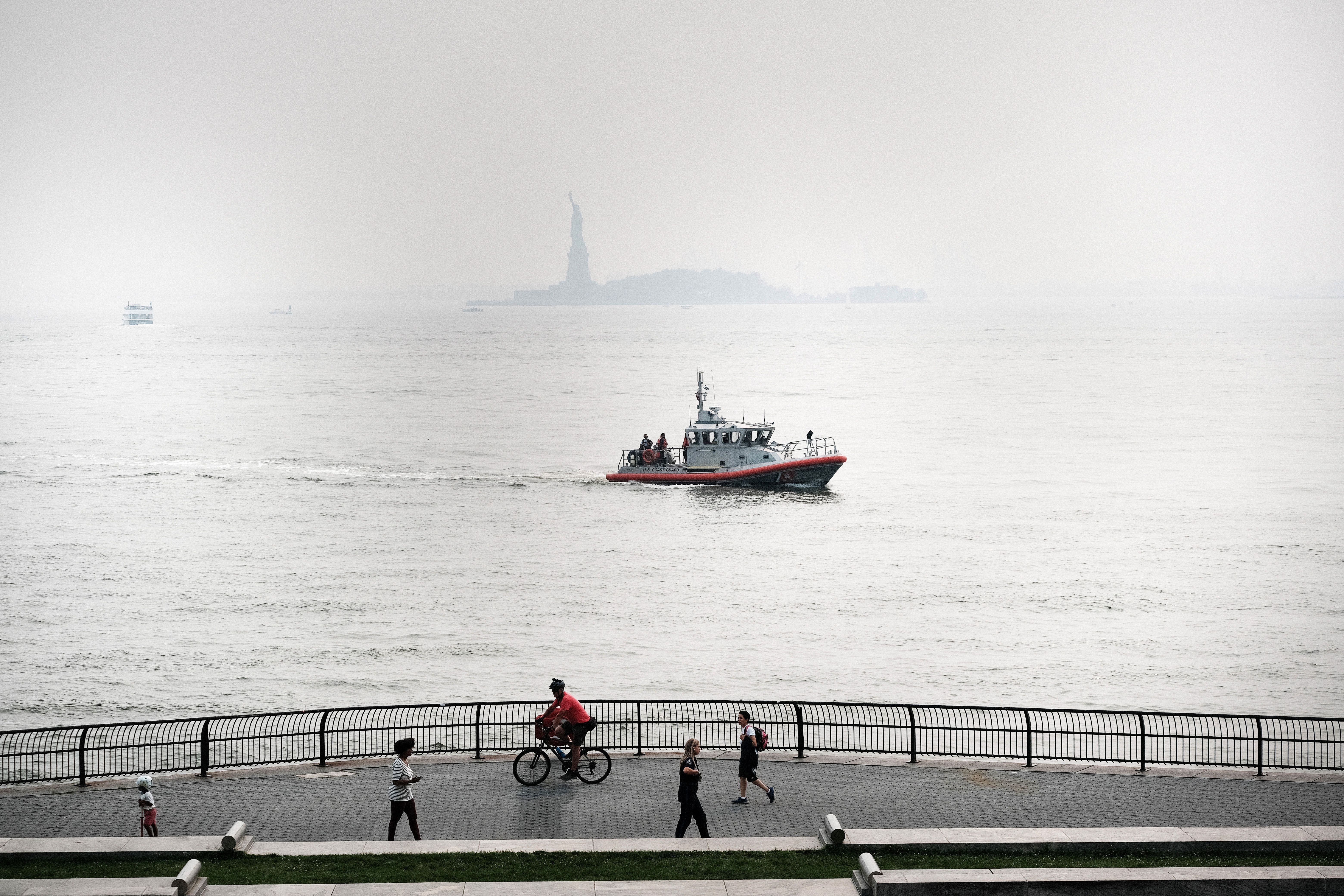 The Statue of Liberty barely visible in the distance in New York City on July 20.