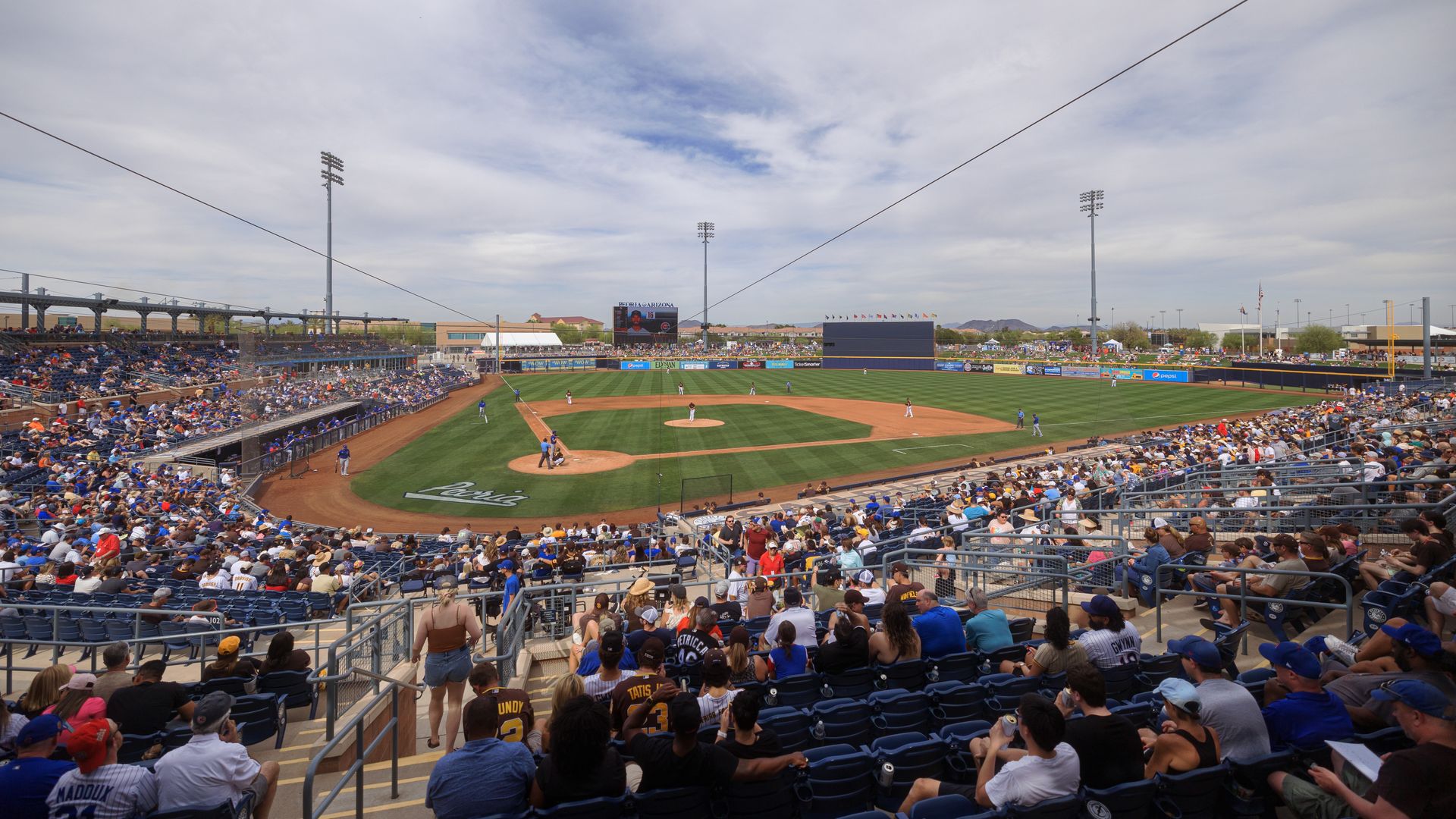 A baseball park filled with fans.