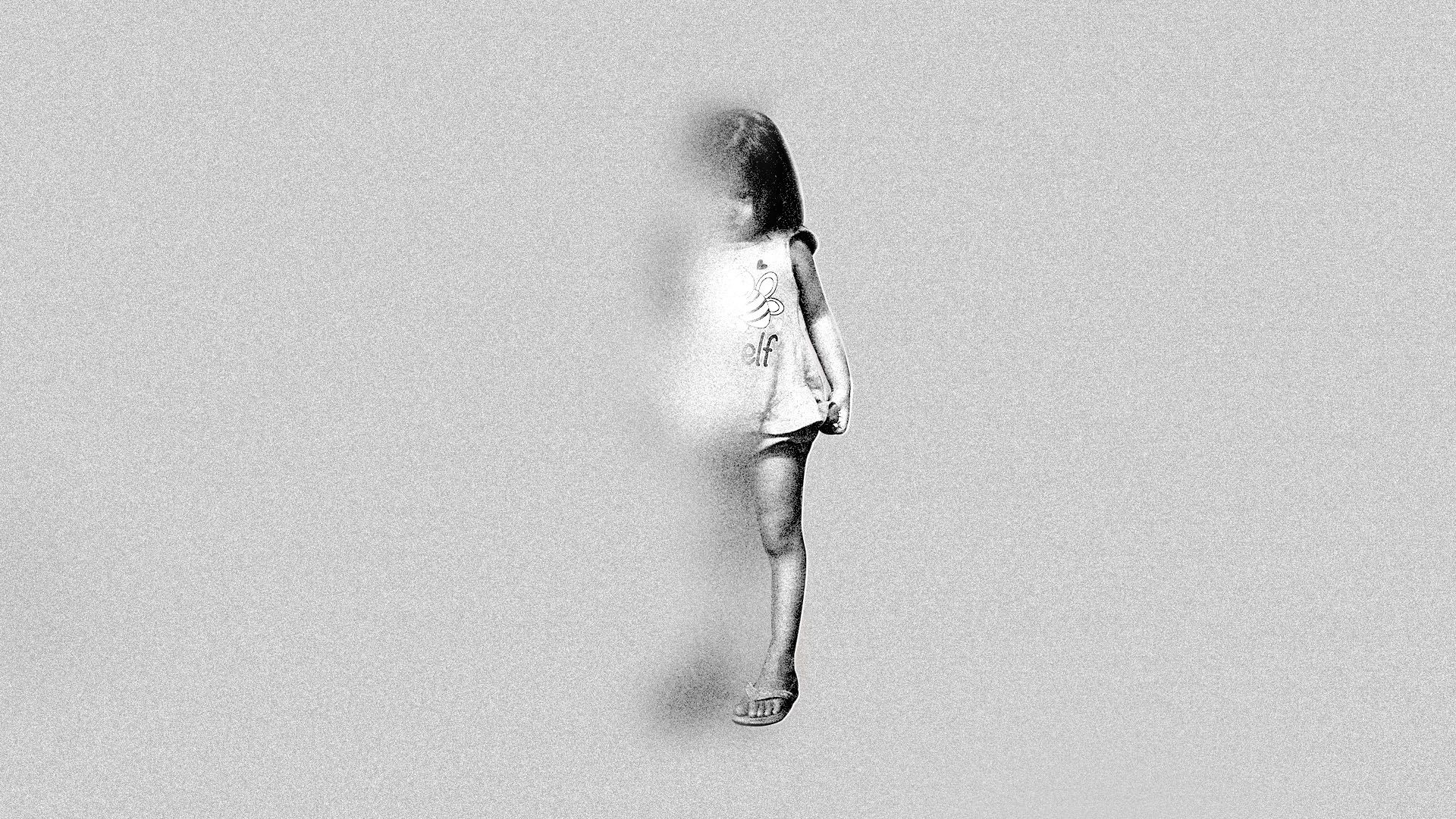 Image of young girl fading into a gray background
