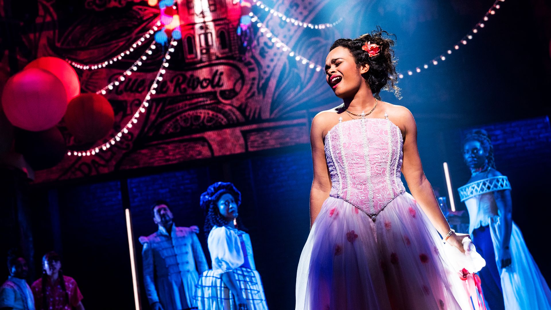 A women singing in costume in the Broadway musical "& Juliet" 