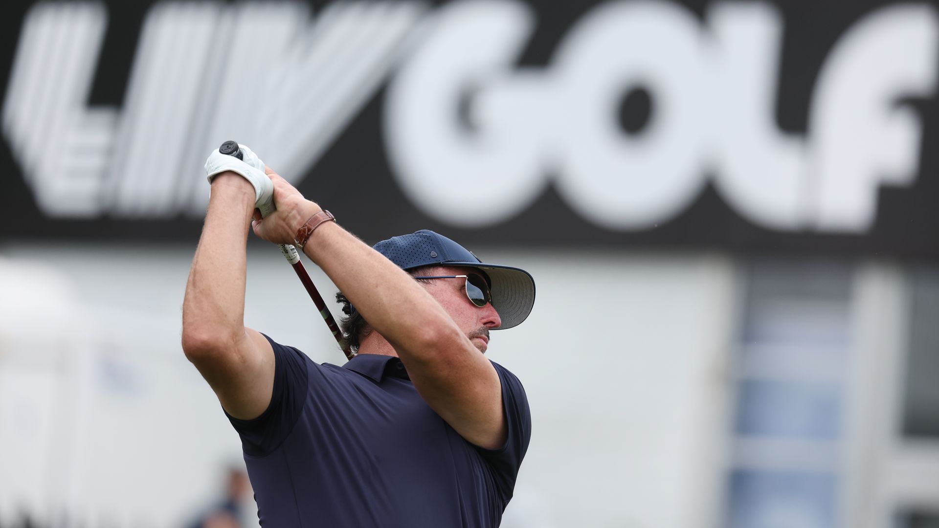 Team Captain Phil Mickelson of Hy Flyers GC plays a shot on the practice range during day one of the LIV Golf.